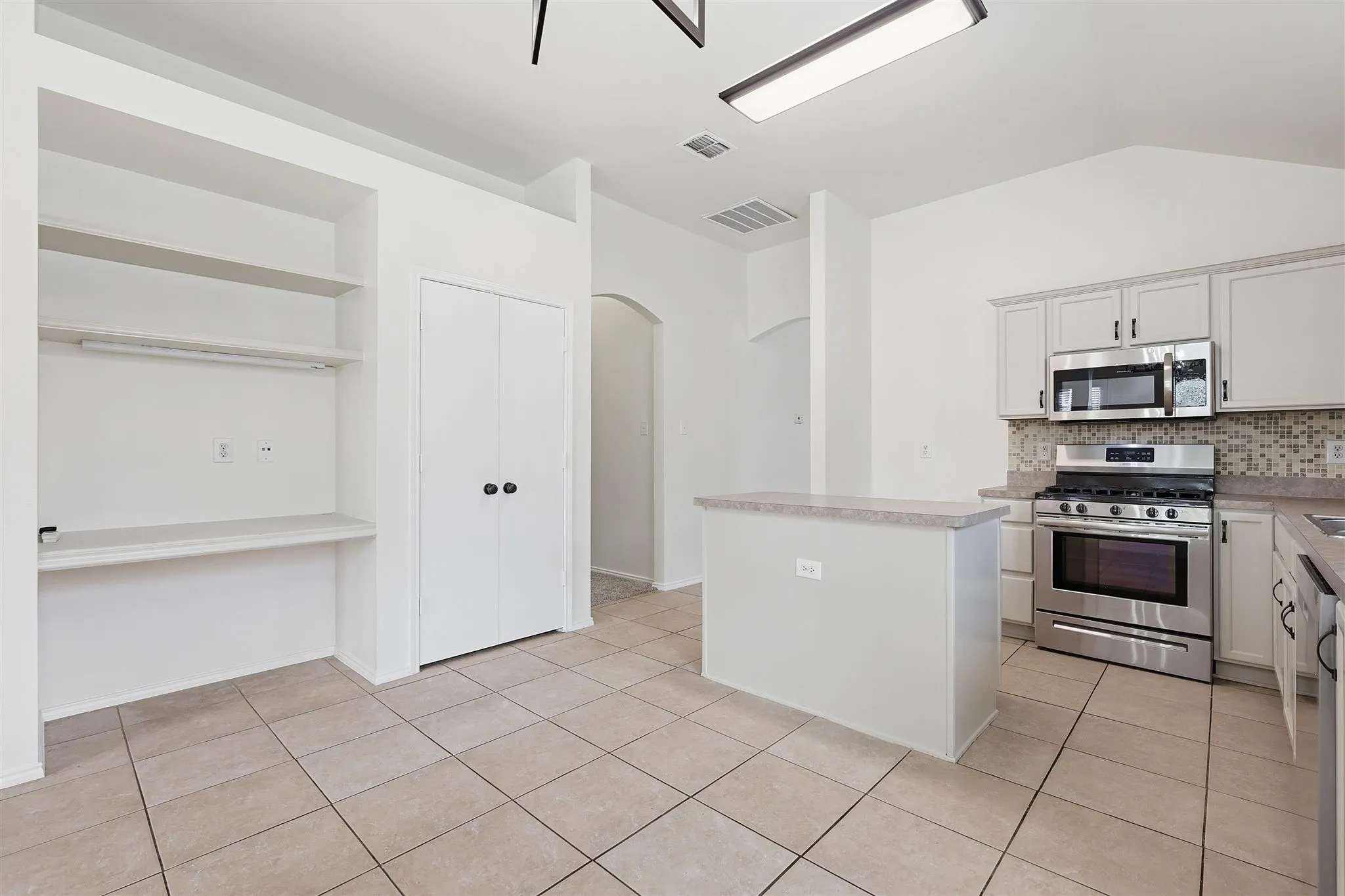 Kitchen has built in desk/home center