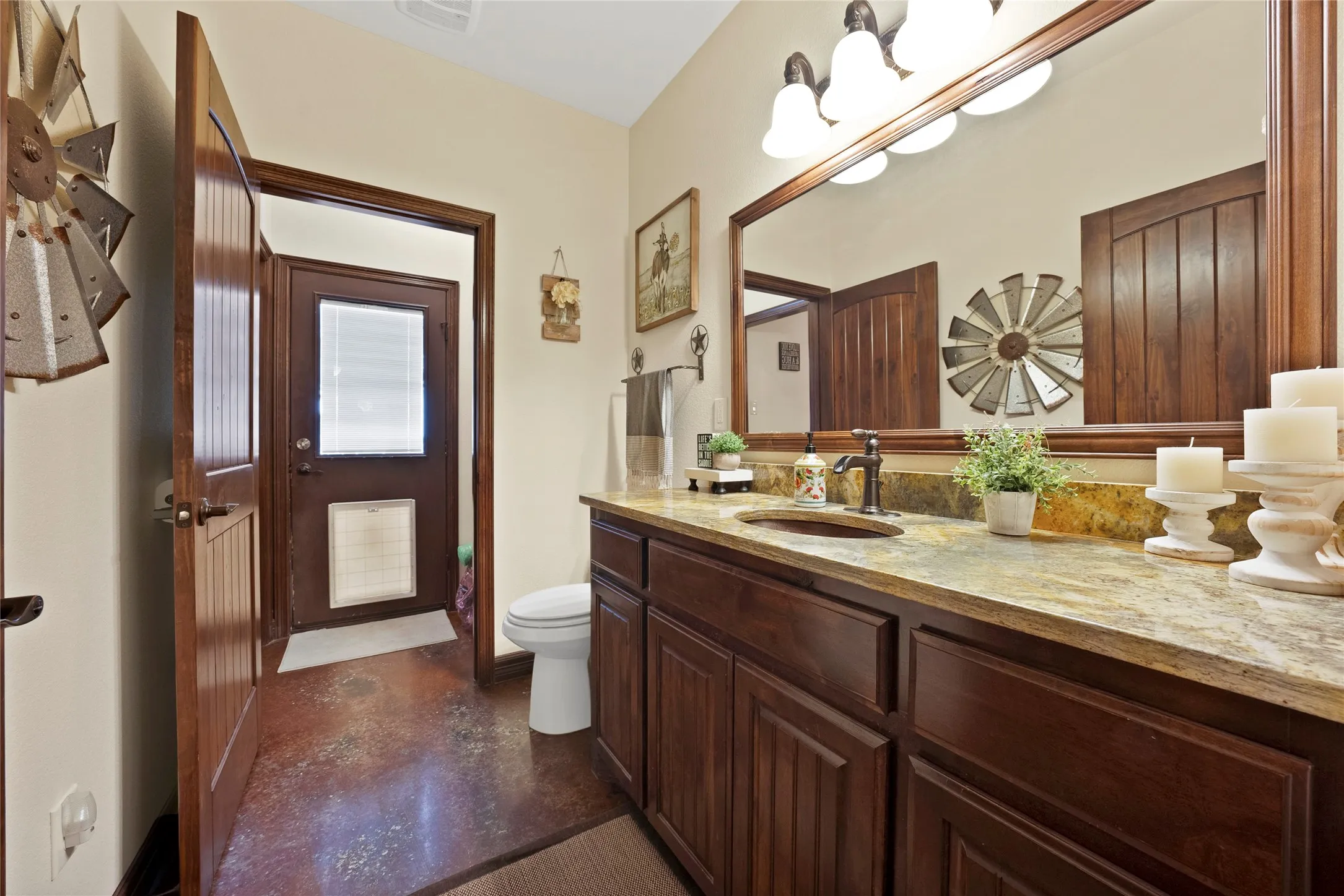 Half bath with direct access to 4th bdrm and back patio