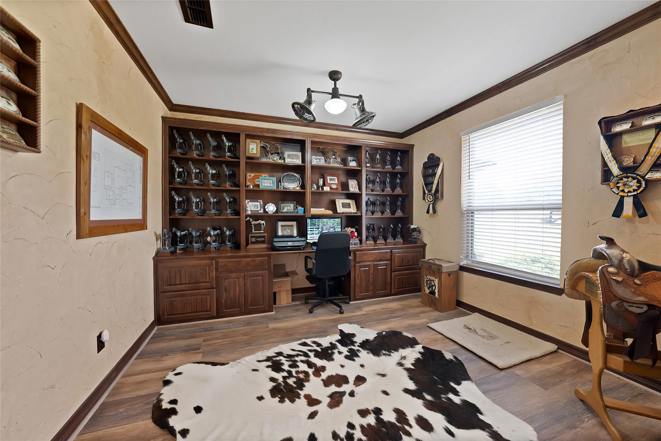 Sliding barn door leads into office with built ins