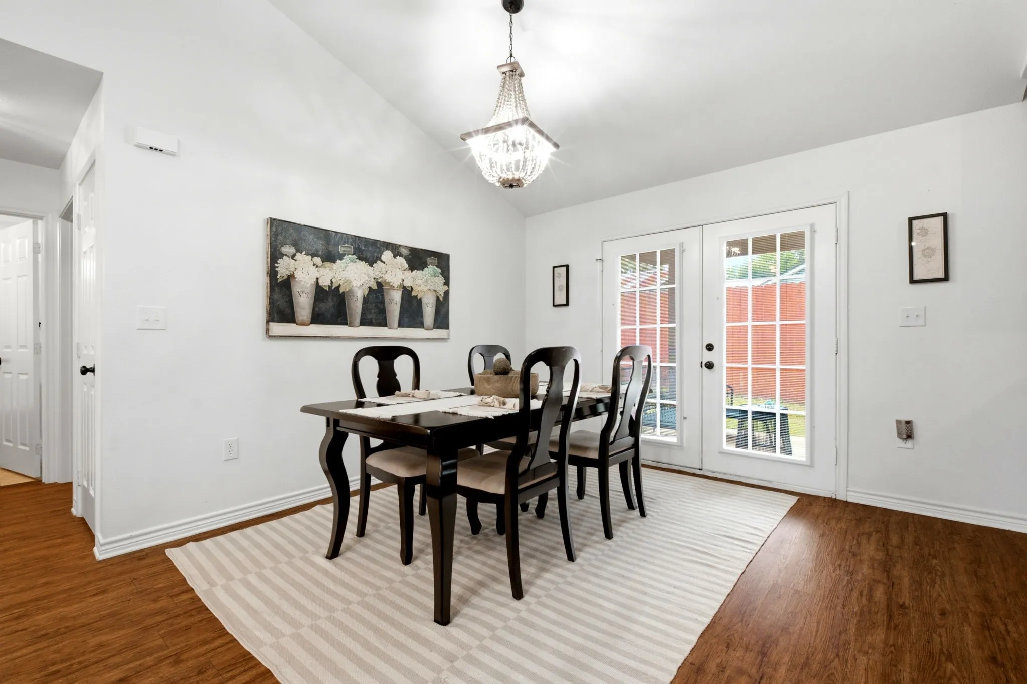 Spacious dining area seamlessly connects to the living room and provides easy access to the backyard.