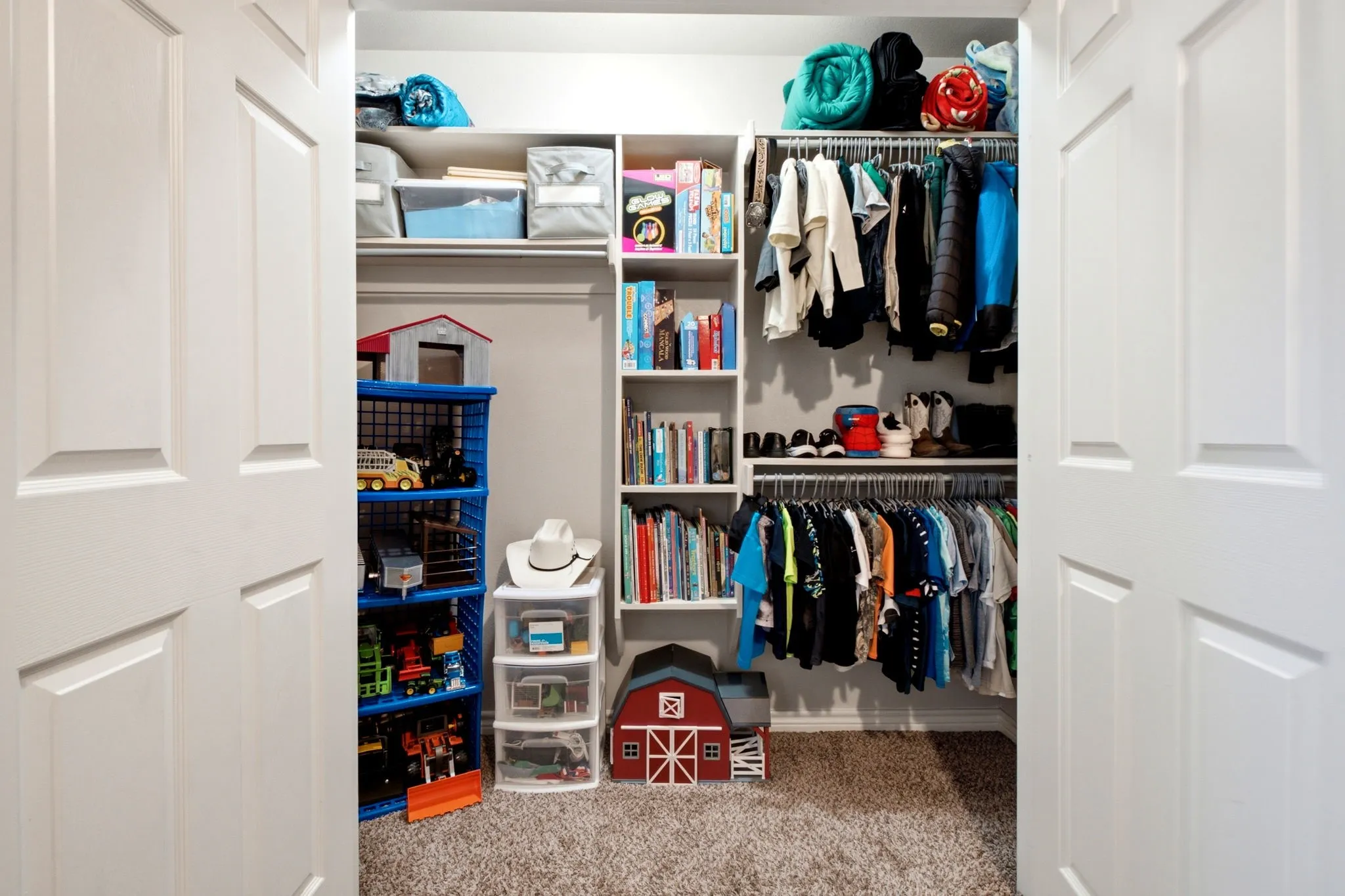 Large custom closet in secondary bedroom provides exceptional storage and organization.