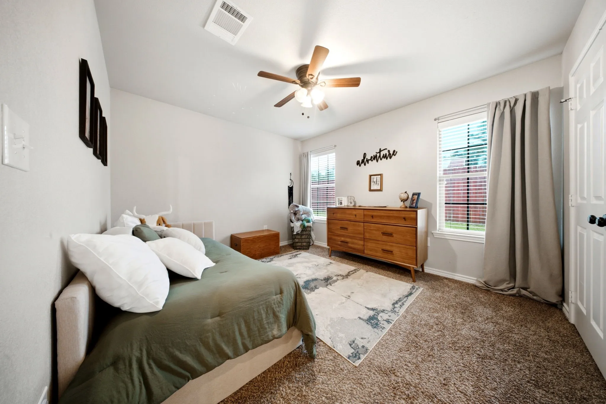 Secondary bedroom offers comfortable accommodations with generous closet space and natural light.
