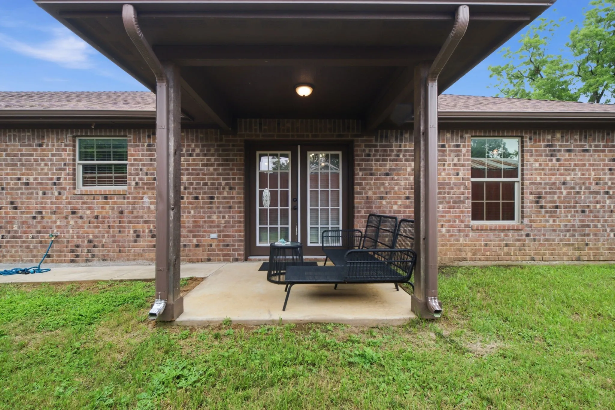 Covered outdoor entertaining area with easy access to the home and plenty of room for seating and gatherings.