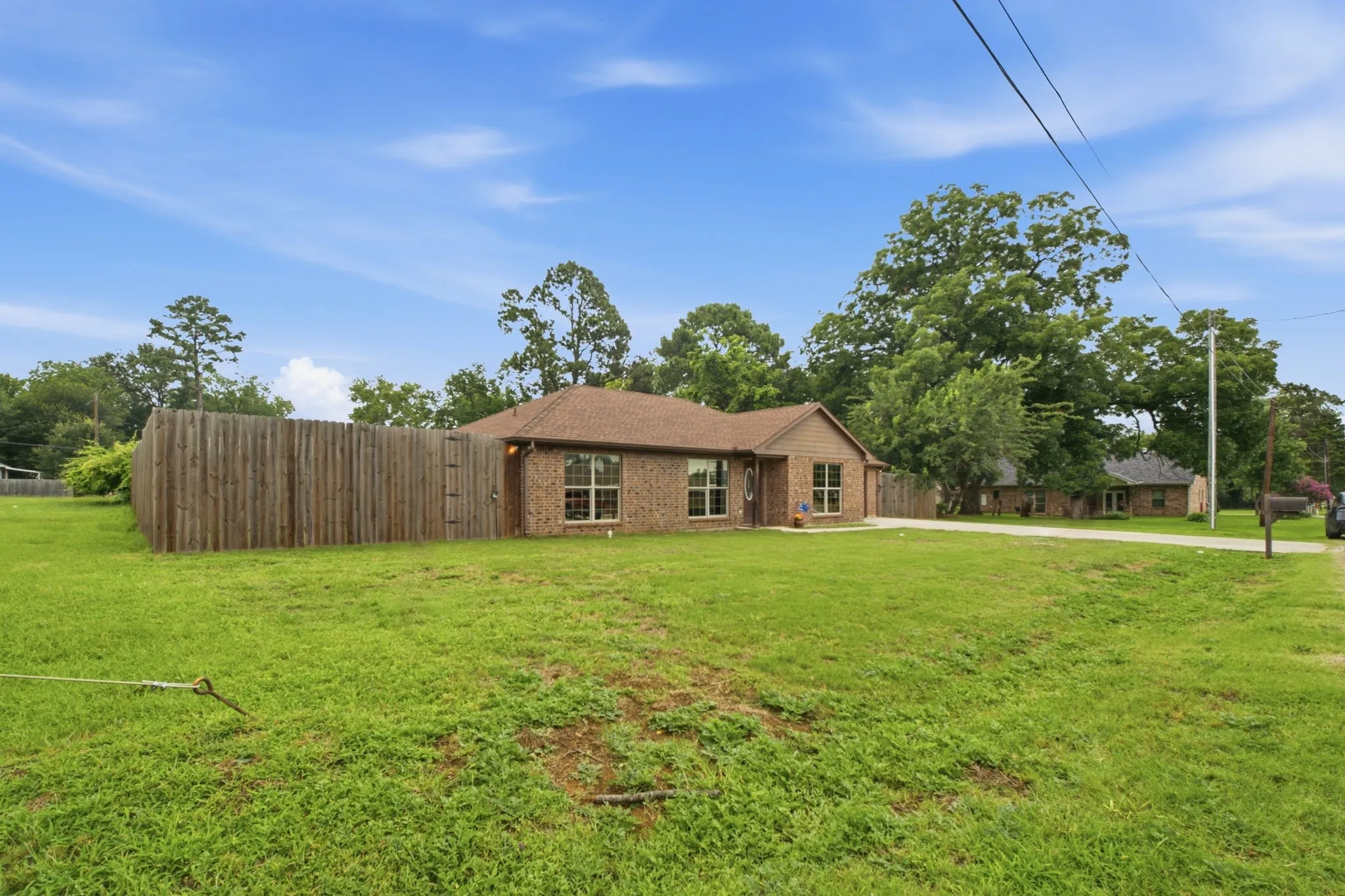 Large corner-style lot provides additional outdoor space and enhances the property's open feel.