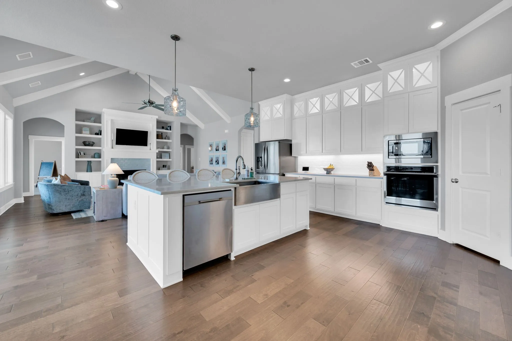 Open-concept living space featuring wood-finish flooring