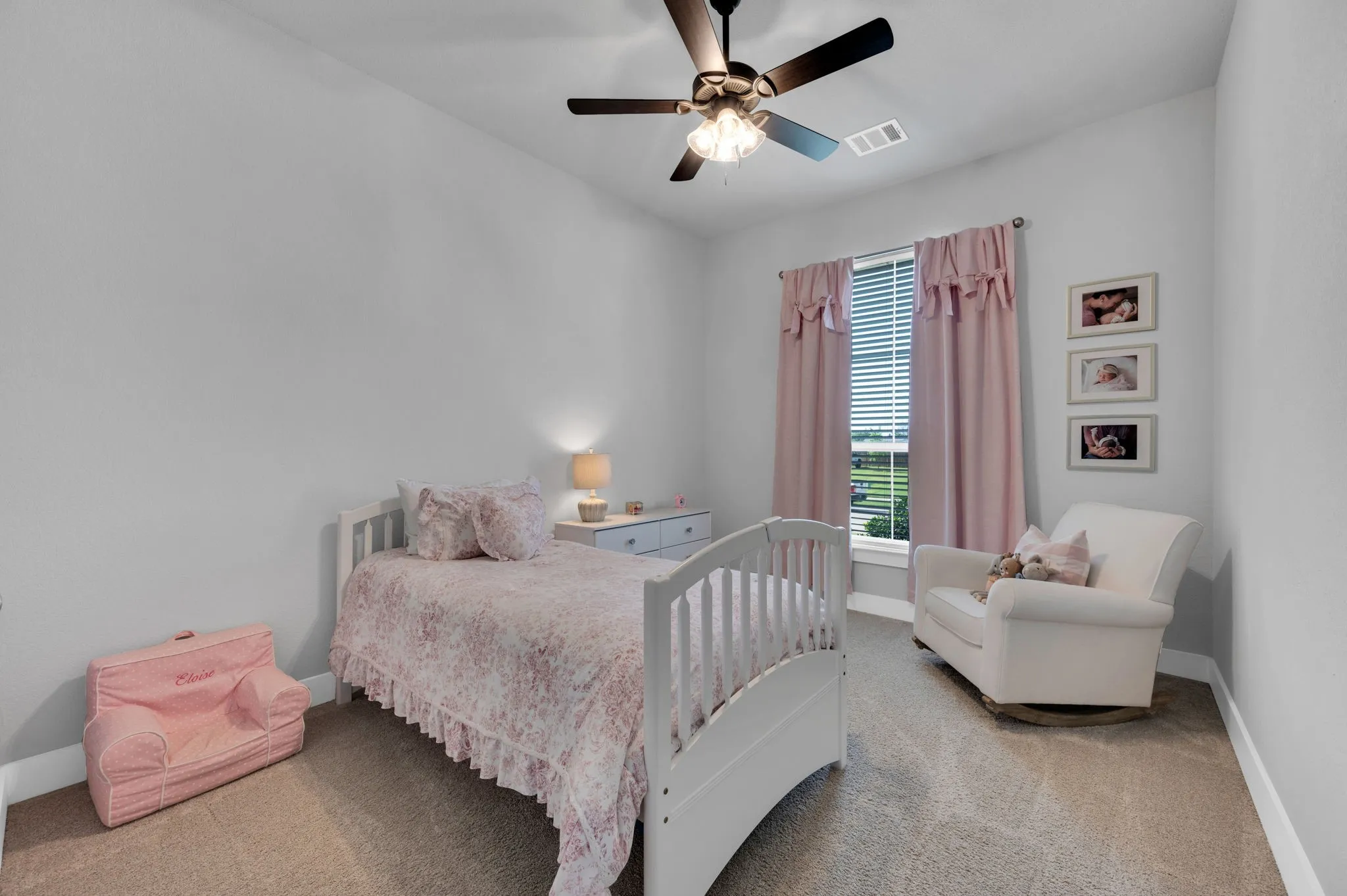 Bedroom featuring light gray walls and neutral carpet flooring