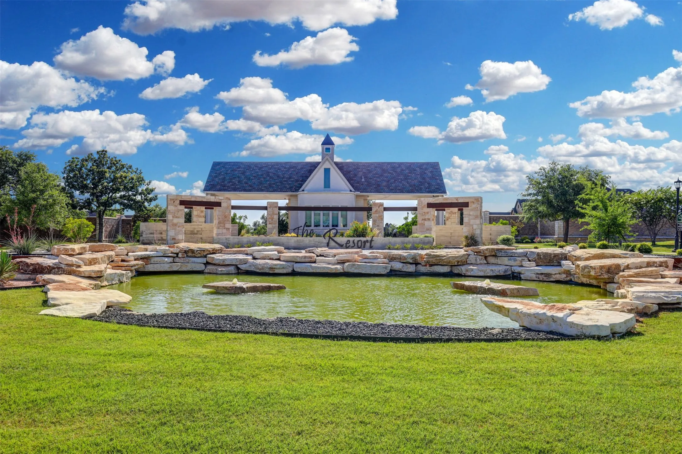Elegant, gated entrance sets the tone for The Resort’s refined lifestyle.