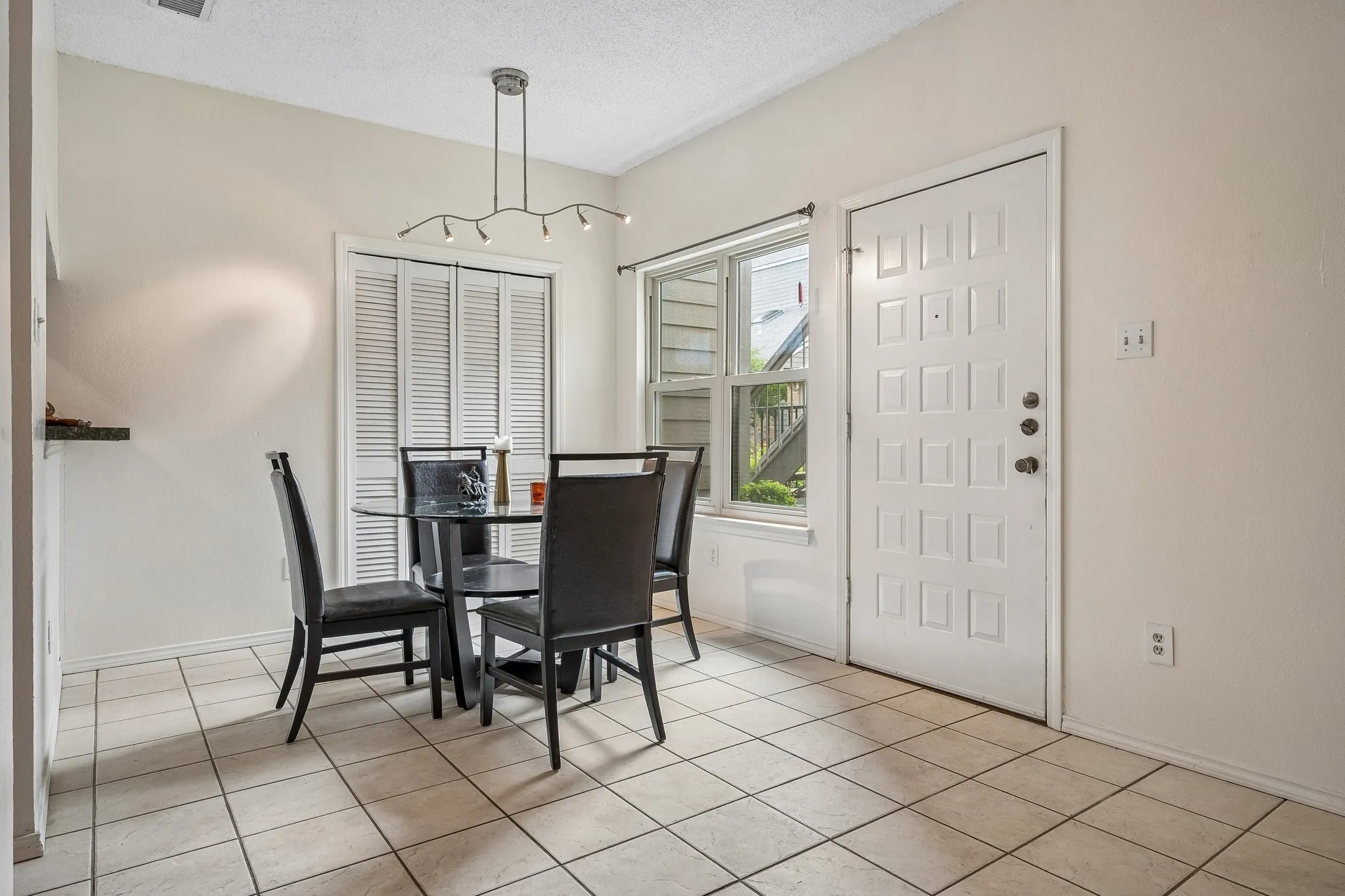 Dining area overlooks private courtyard.