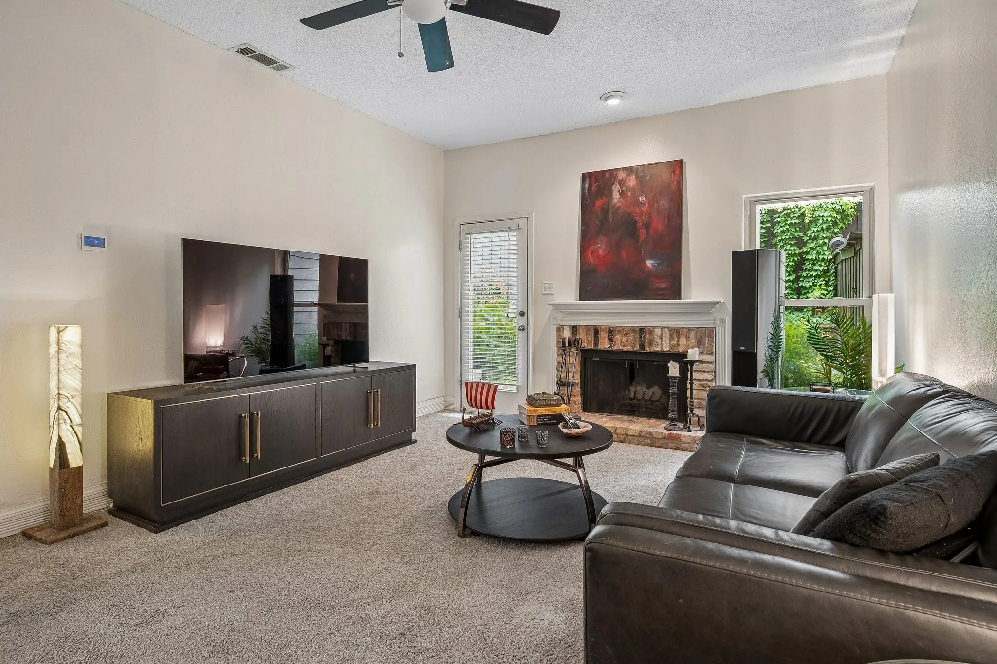 Living area with view of private patio.