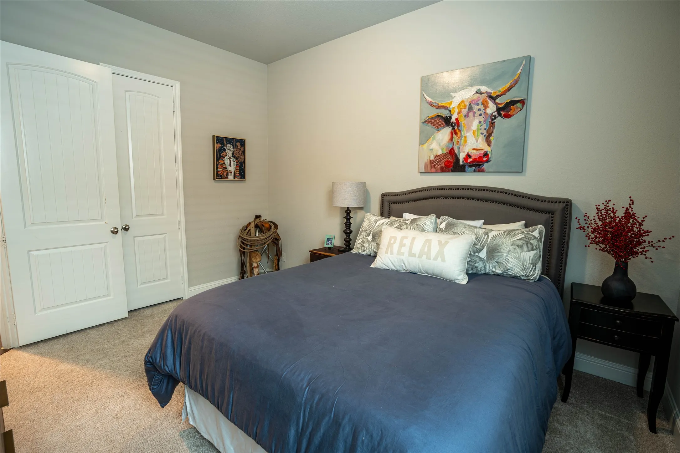 Bedroom featuring neutral wall paint and light carpet flooring