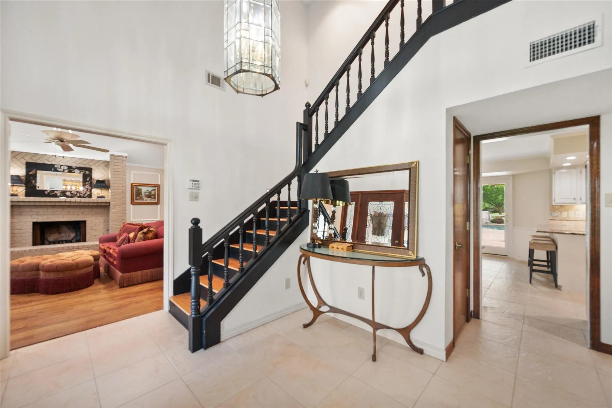 Entryway with view of formal living and view into kitchen