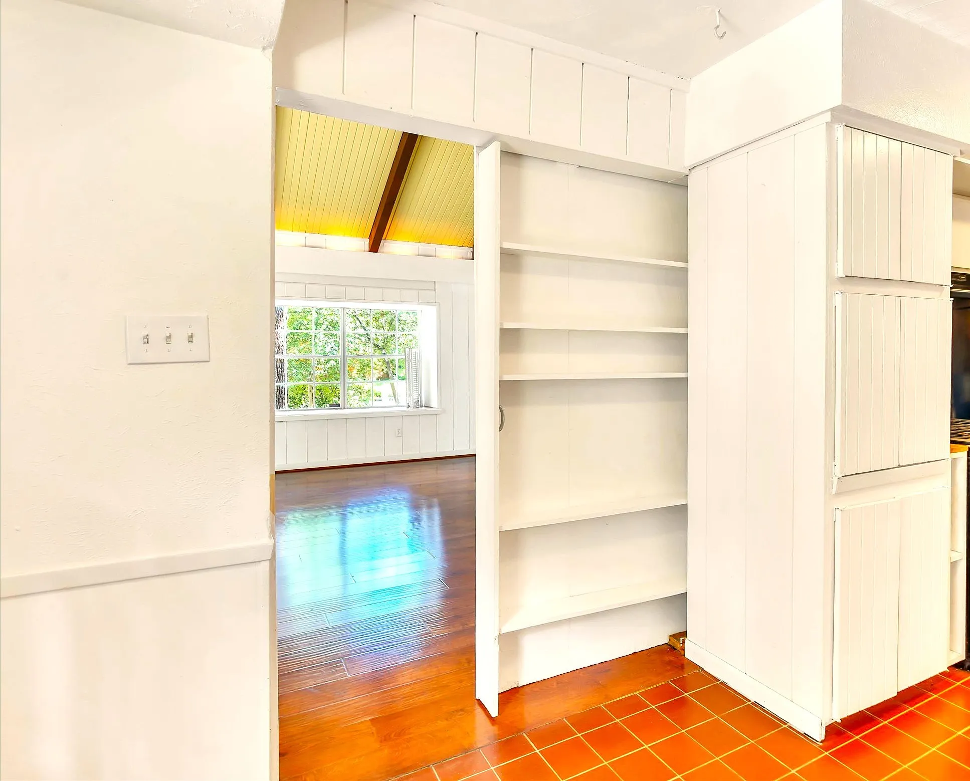 Entrance to large family room from kitchen with pocket door