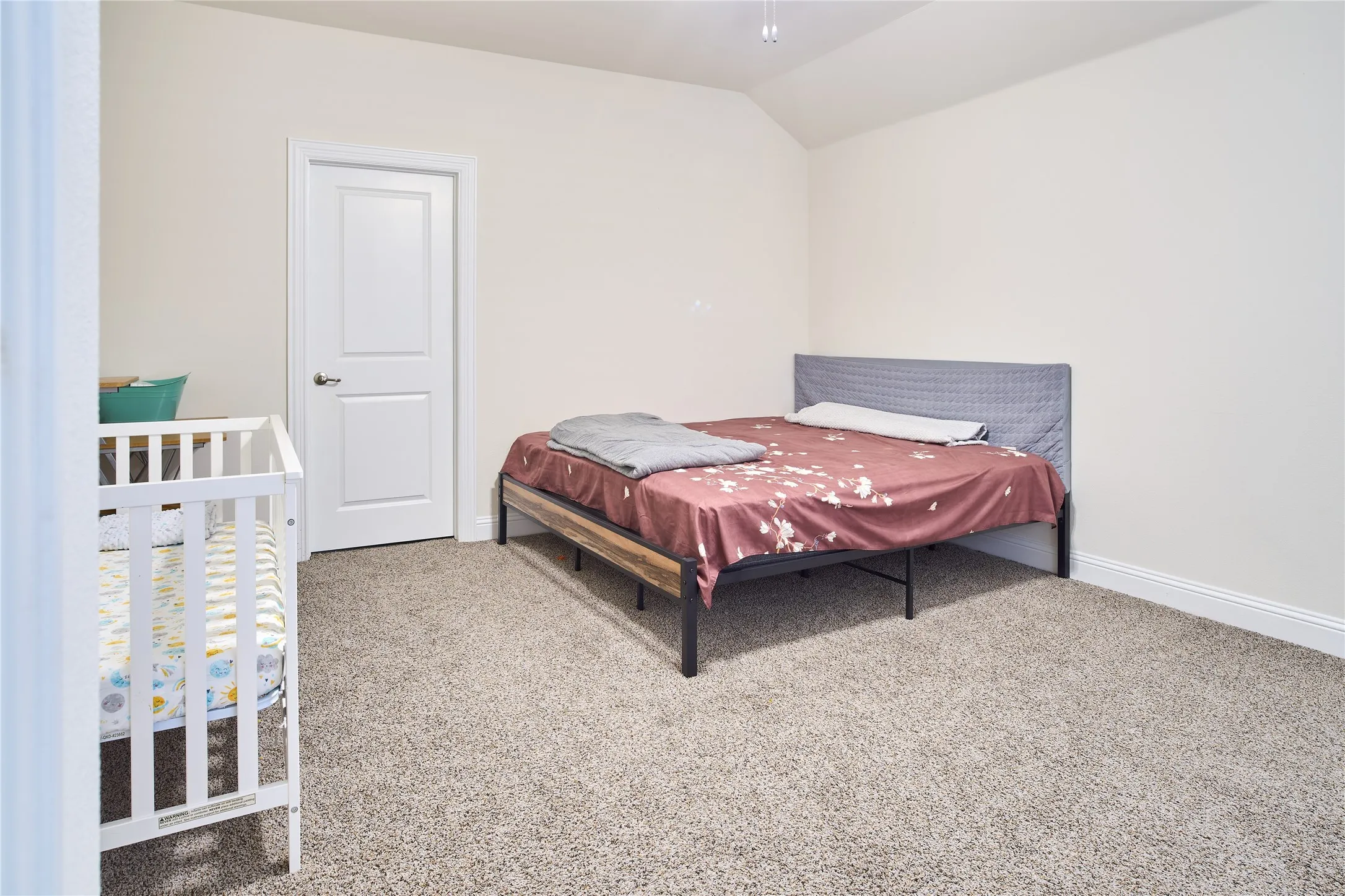 Carpeted interior room with neutral-toned walls