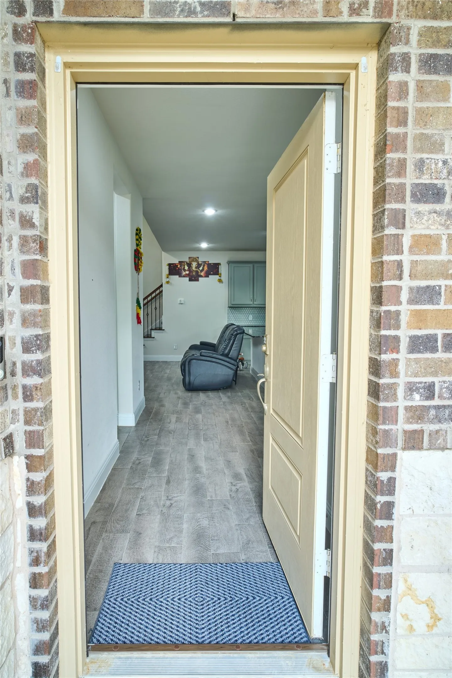 Entryway featuring wood-look flooring and recessed lighting