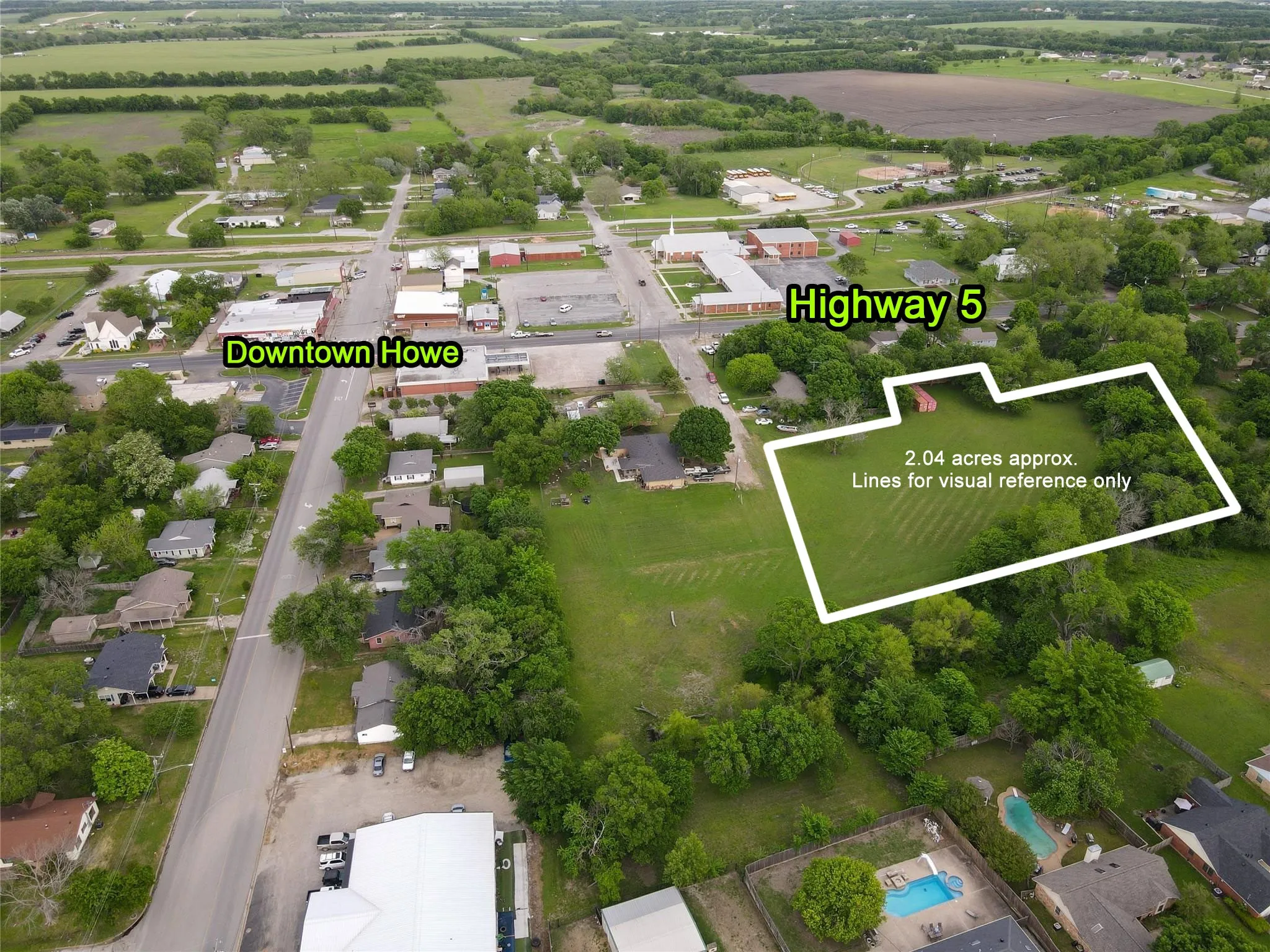 2.04-acre parcel of land featuring a partial tree line