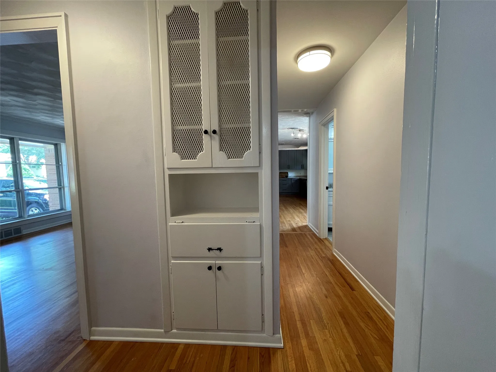 Charming built-in linen storage and clothes hamper