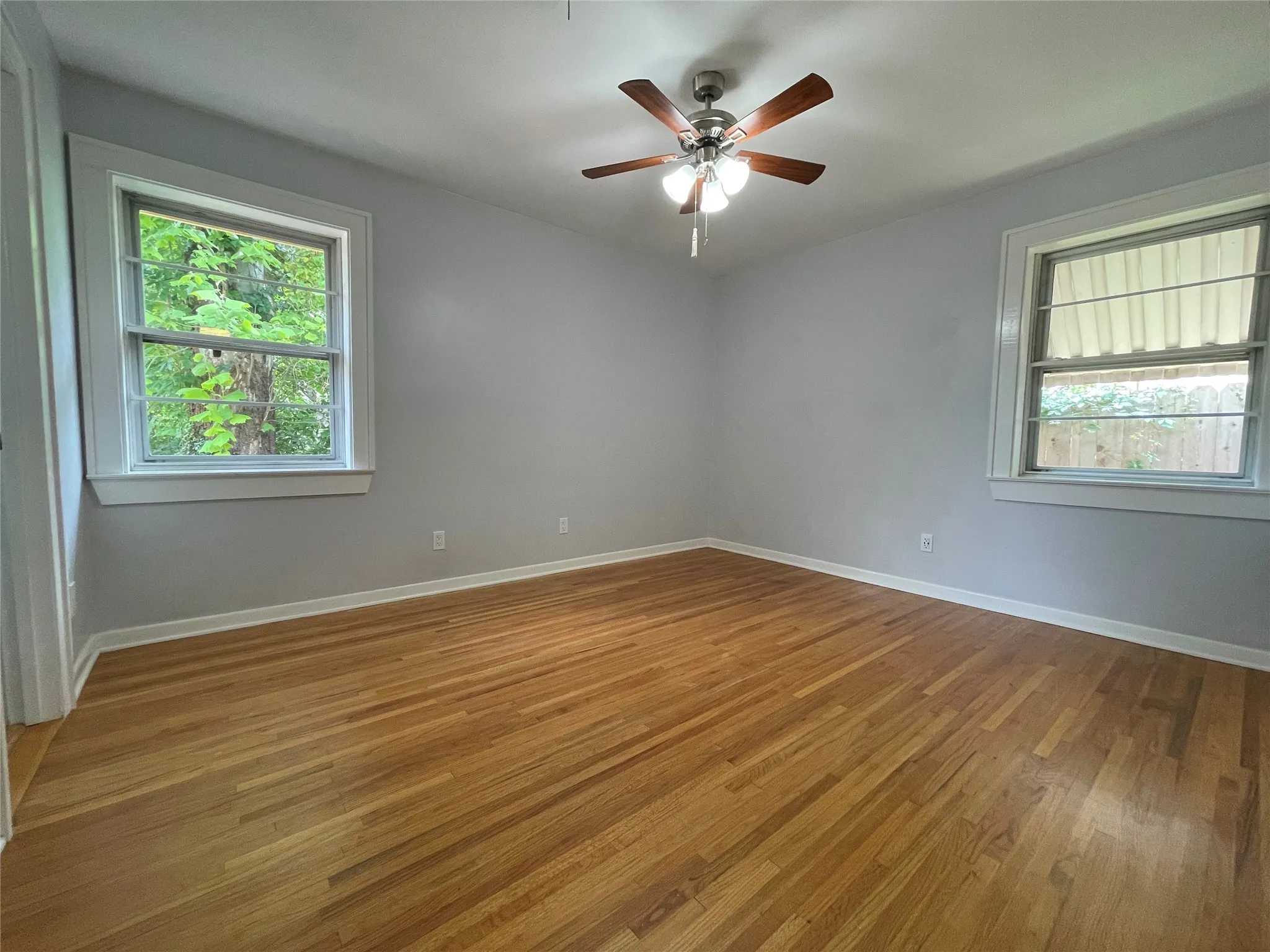 Includes updated private bathroom, ceiling fan, views to backyard