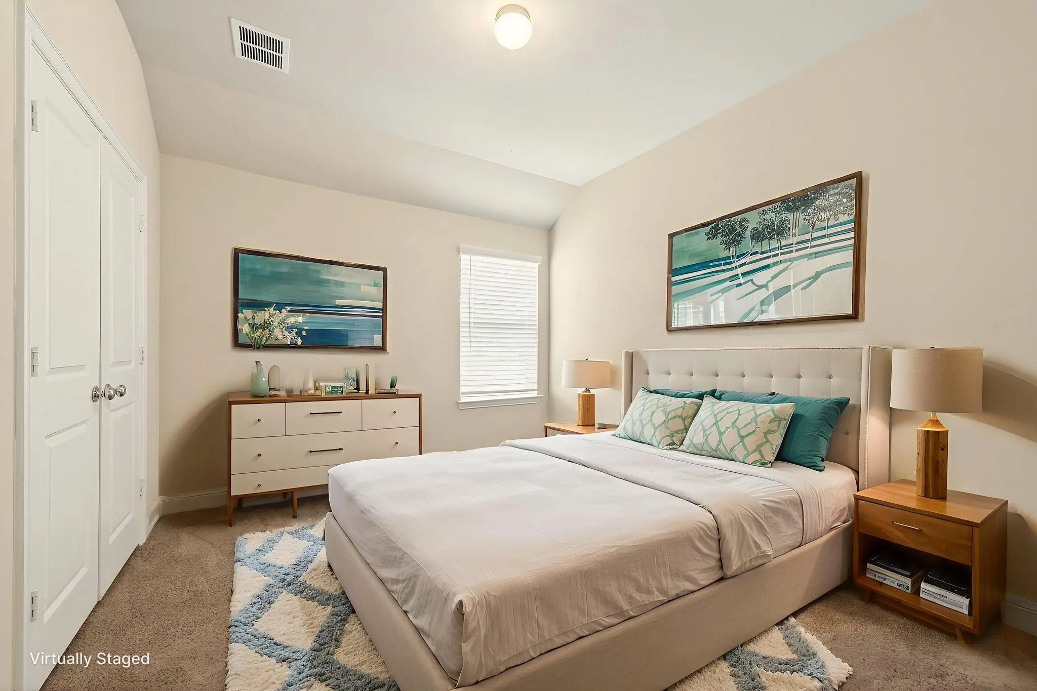 Secondary bedroom featuring neutral wall paint, carpet flooring, a window with blinds, and white bi-fold closet doors