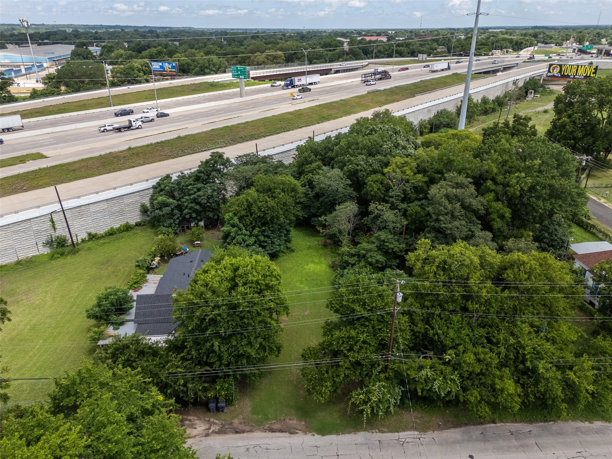 Expansive lot featuring mature trees and green spaces