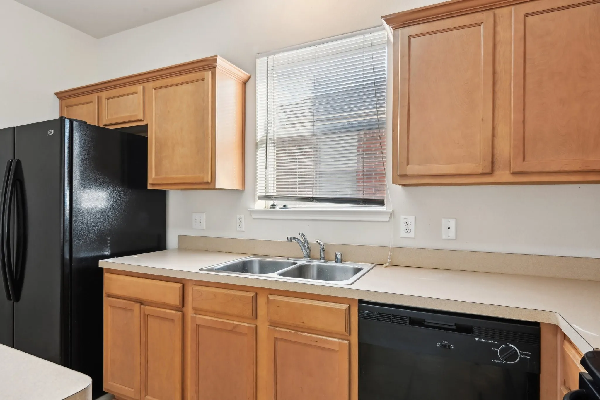 Kitchen with sink and black appliances