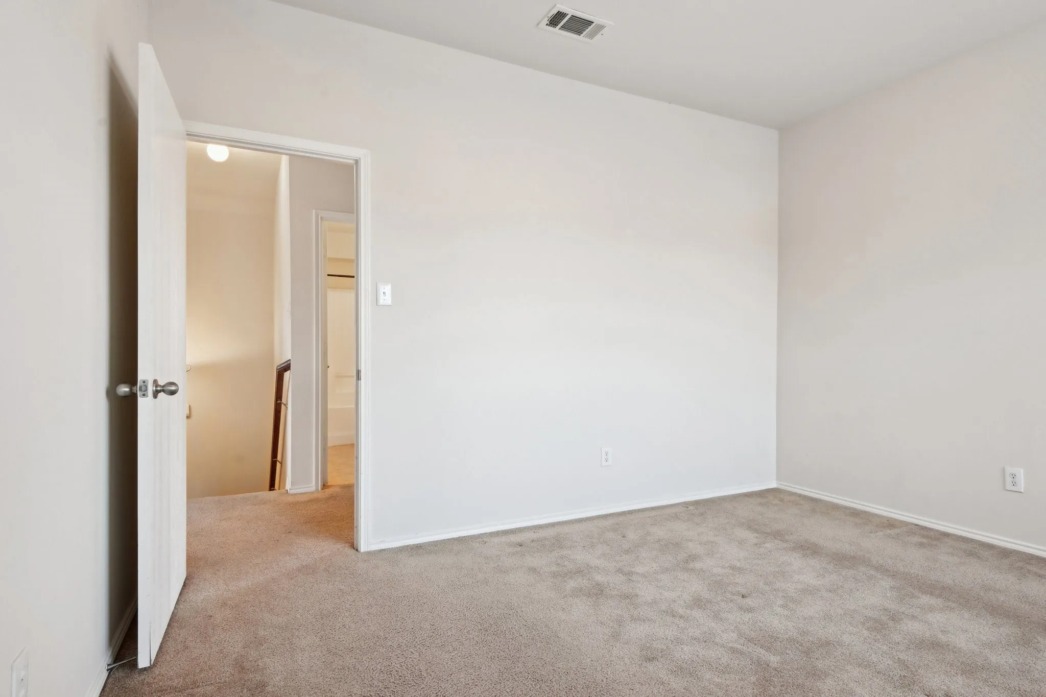 View of carpeted spare room