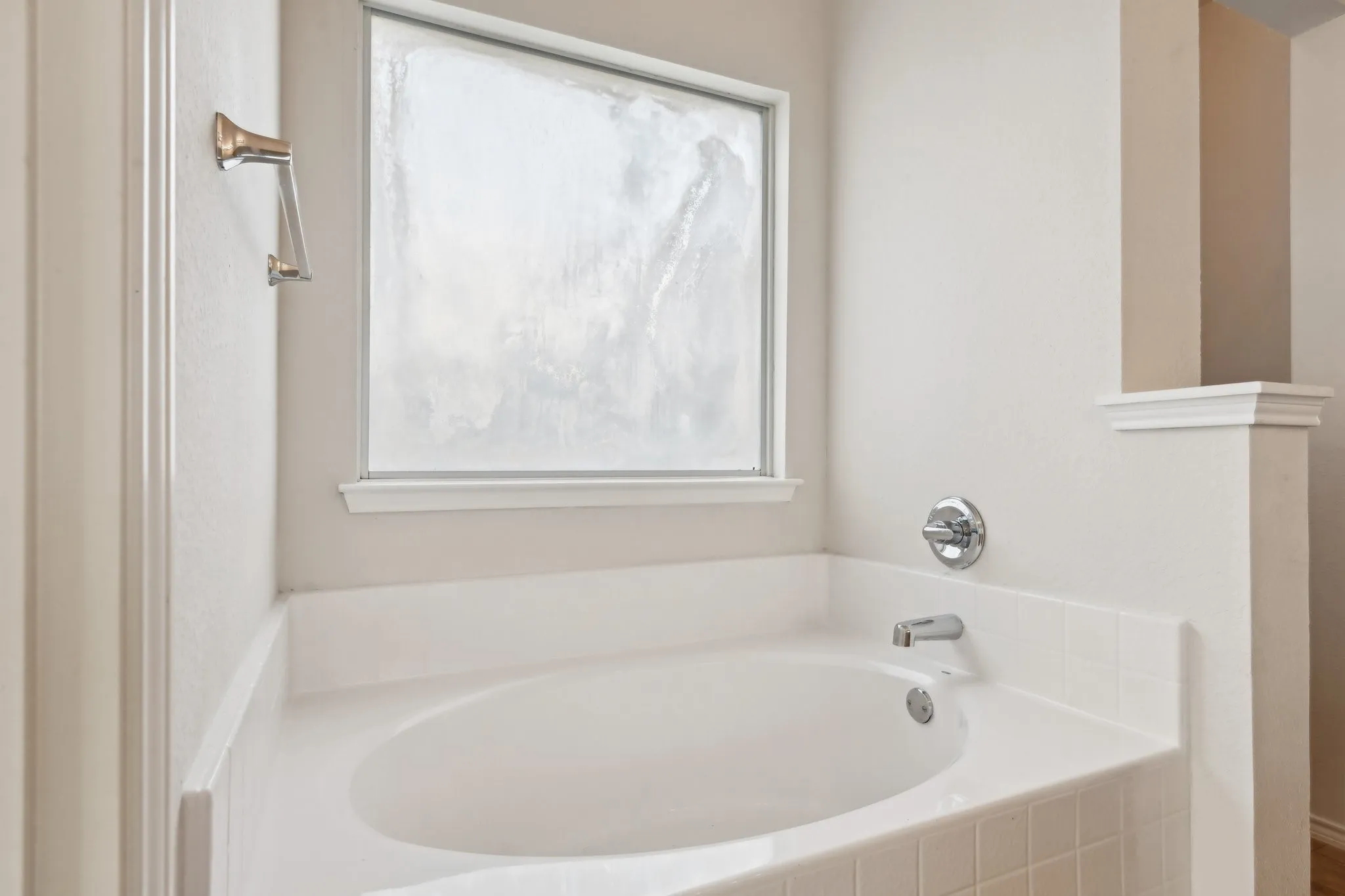 Bathroom with a relaxing tiled tub