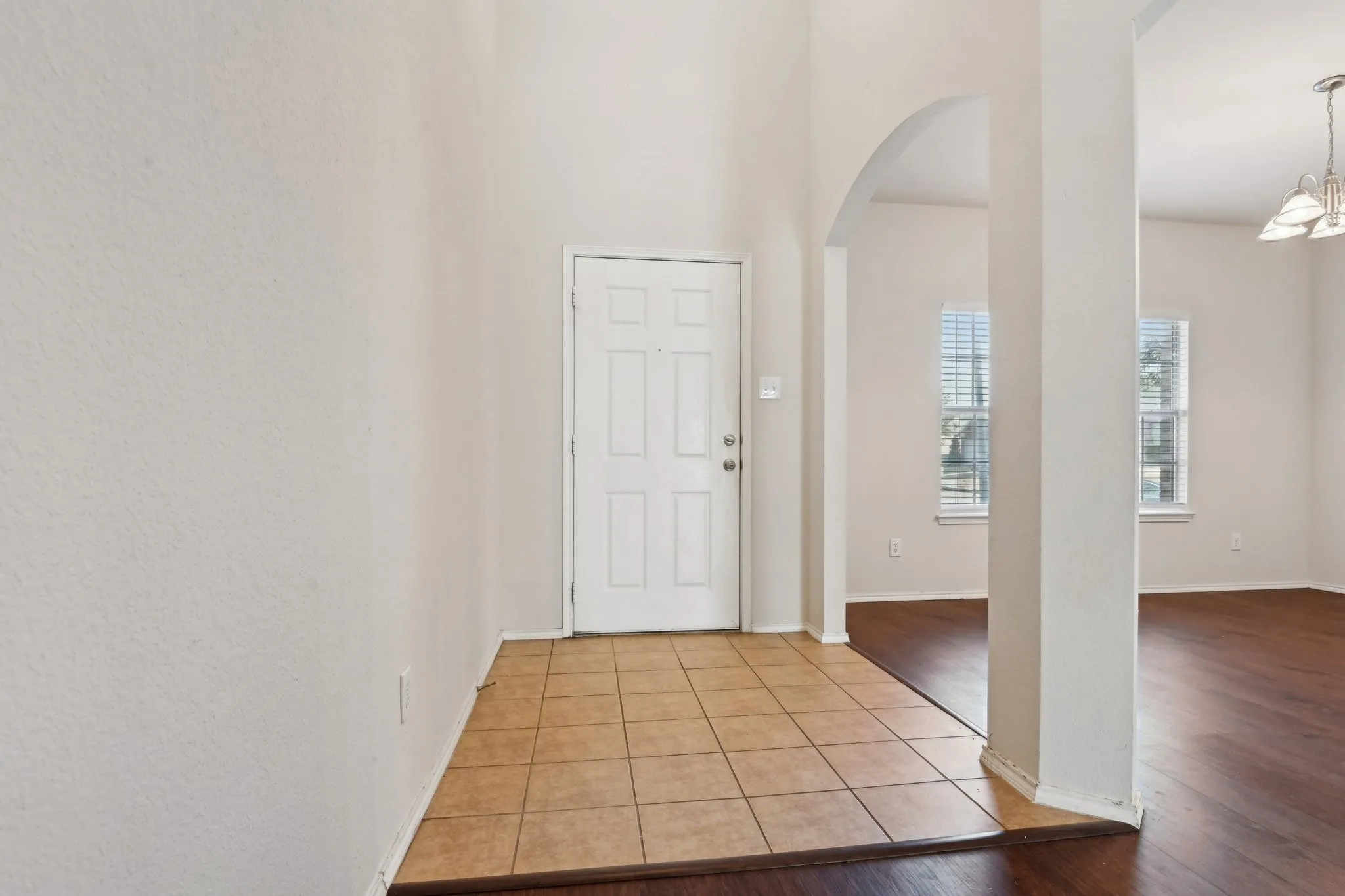 Entryway featuring light wood-type flooring and tile floors