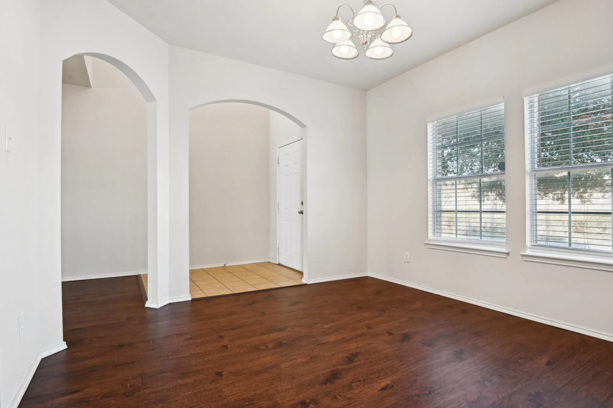 Unfurnished room featuring dark wood-type flooring