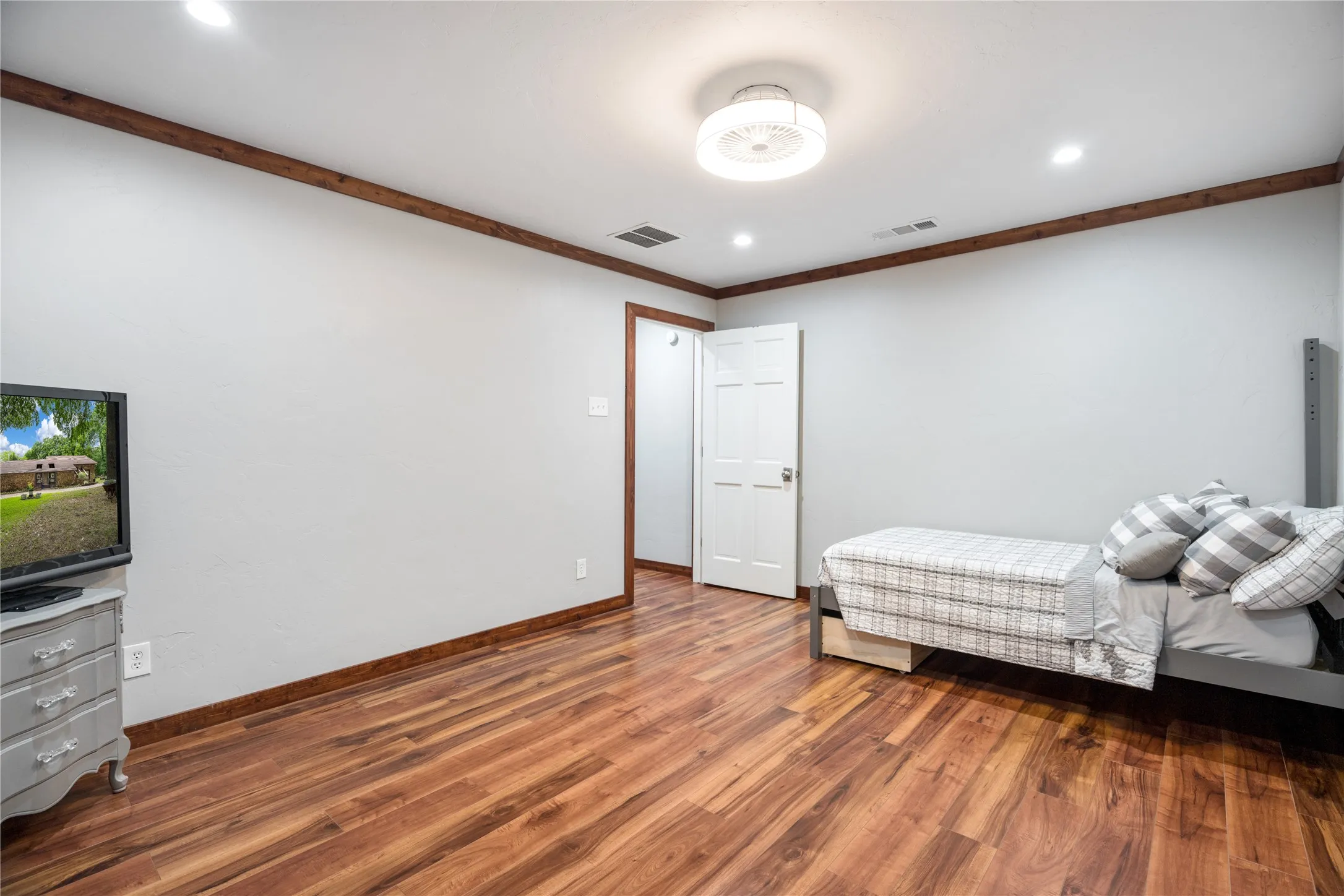 Virtually staged to give appeareance-Open dining space featuring wood-finish flooring, recessed lighting, and a ceiling fan