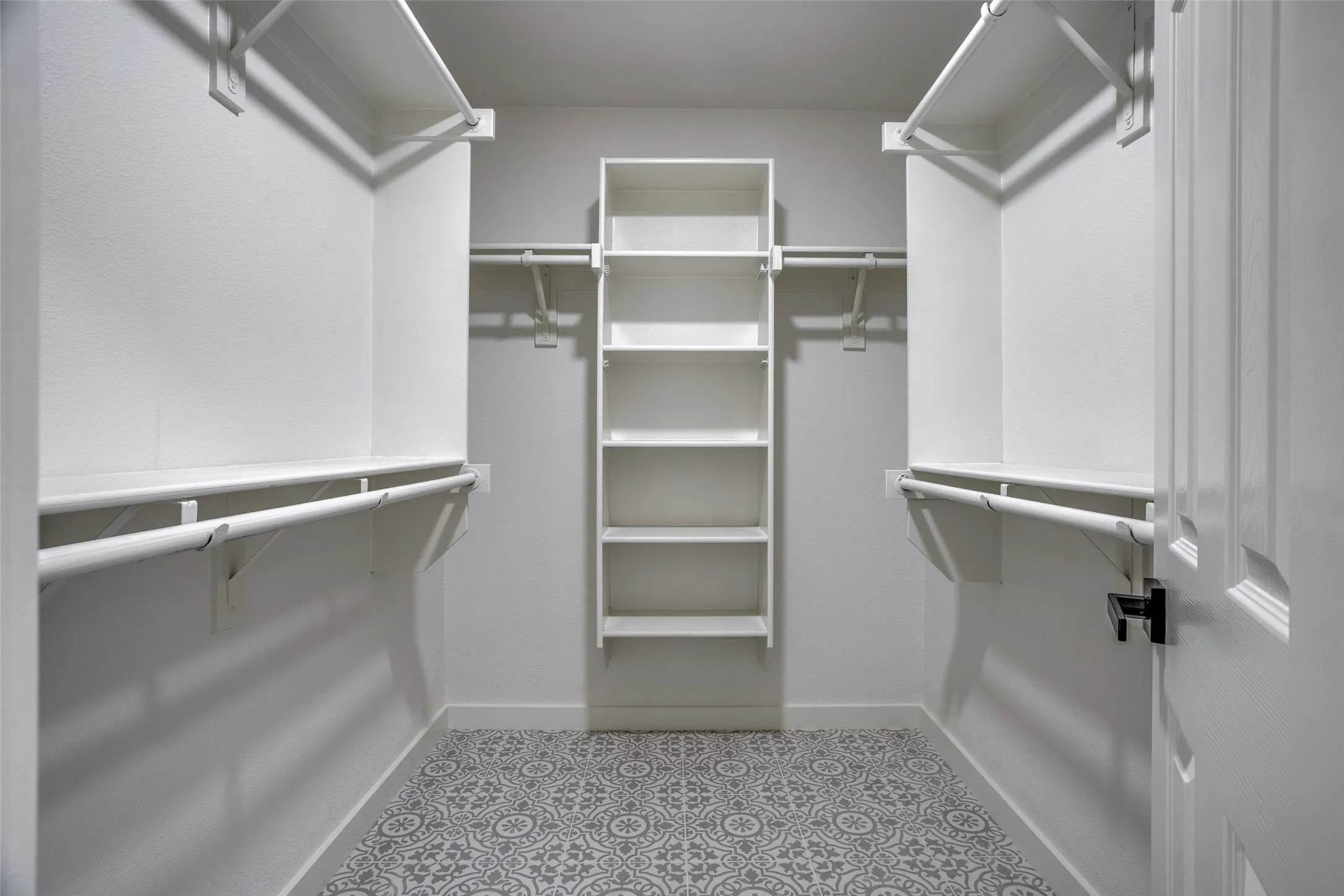 Spacious closet with tile flooring