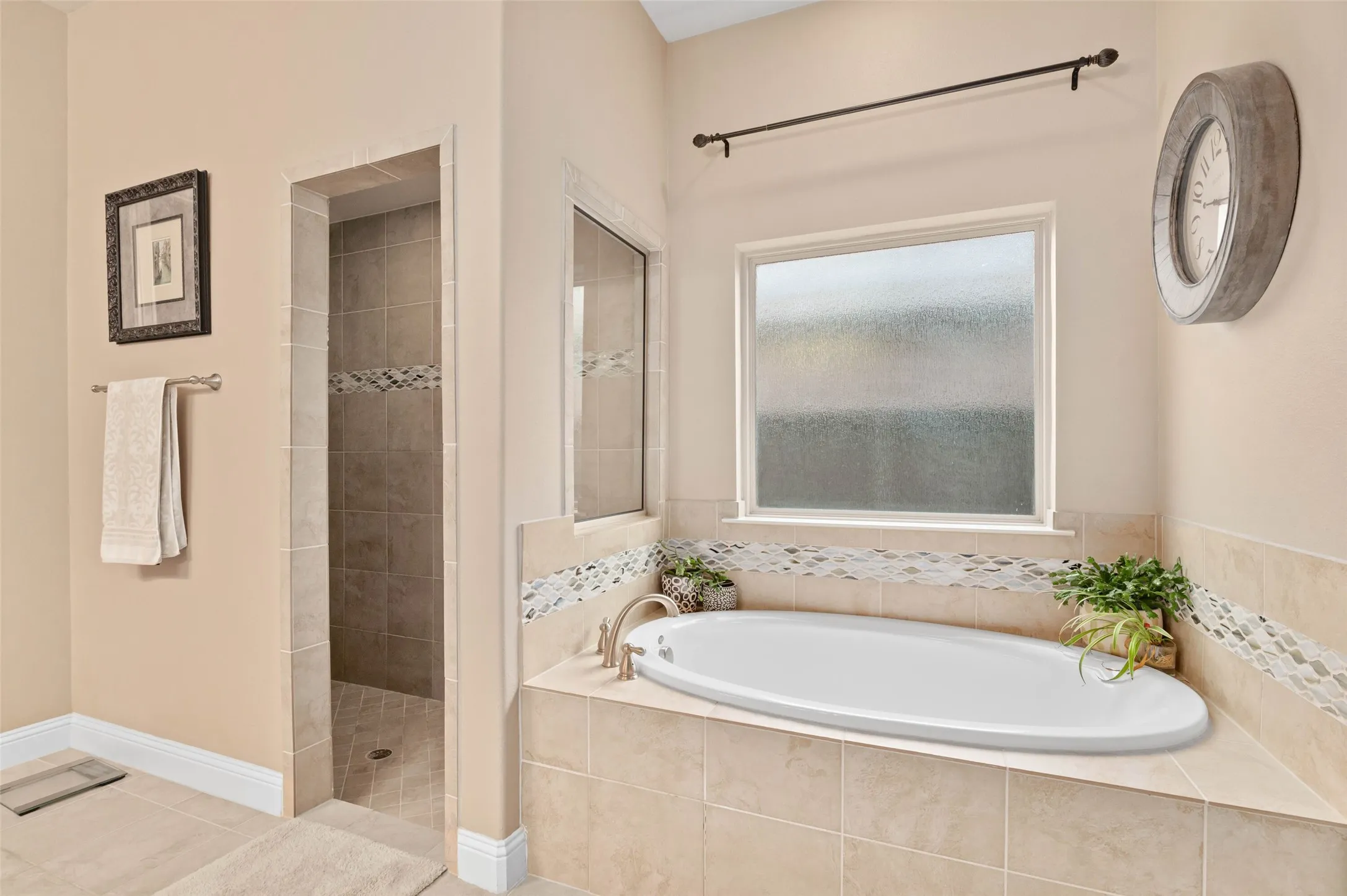 Primary bathroom with walk in shower and garden tub.
