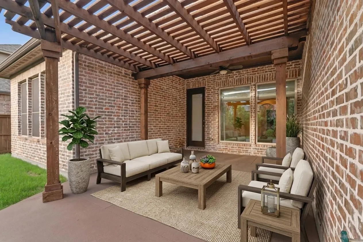 Virtually staged outdoor covered patio with beautiful pergola and plenty of space for outdoor living.