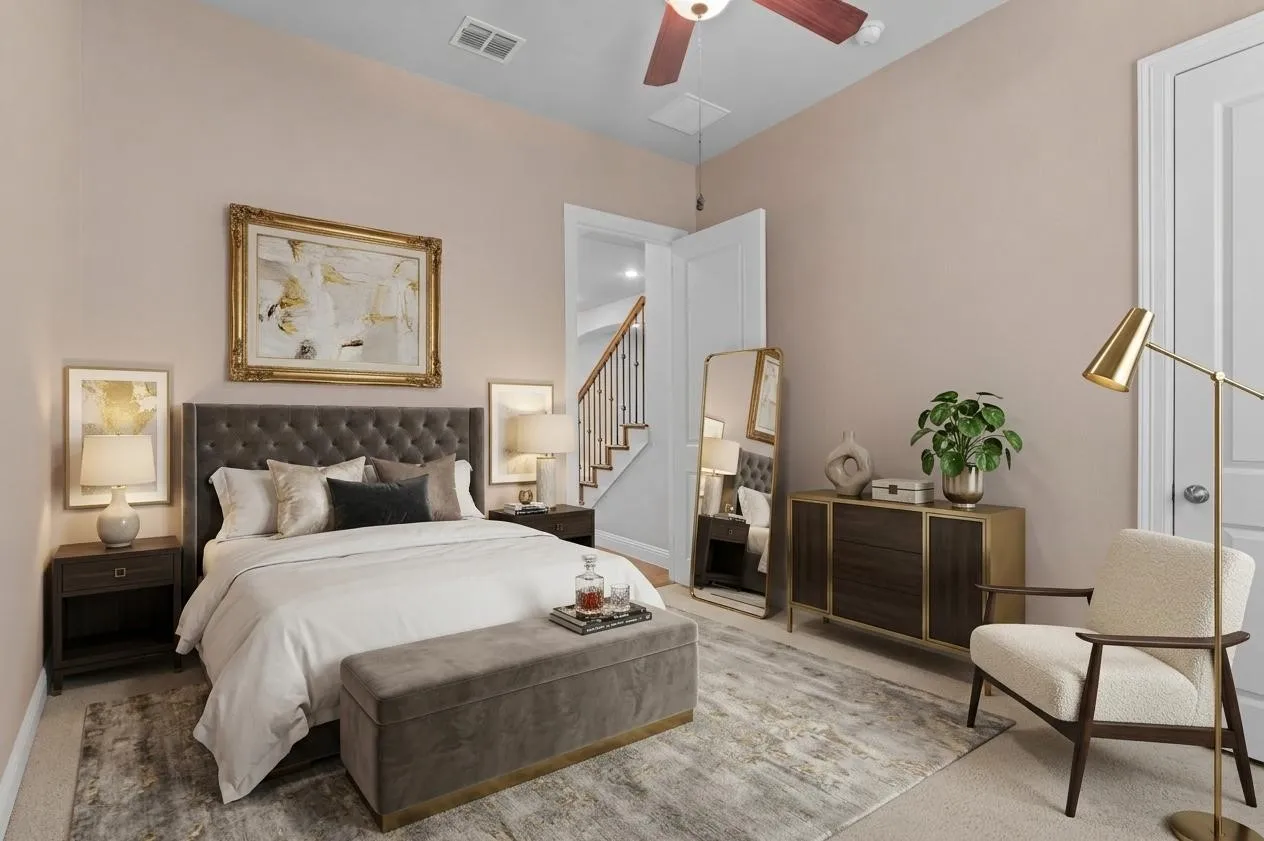 Virtually staged secondary downstairs bedroom featuring a built-in ceiling fan, and carpeted flooring and en-suite bathroom.