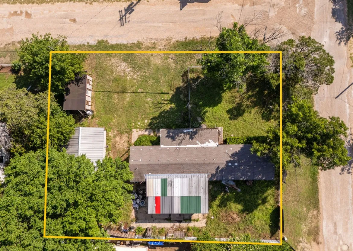Expansive lot featuring mature trees and a detached structure