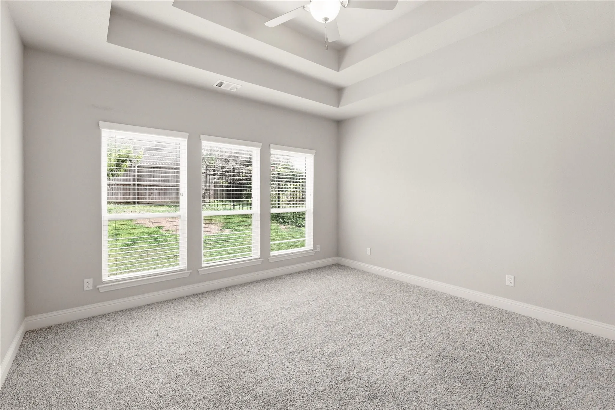 Your private retreat awaits. Spacious primary suite with tray ceilings, abundant natural light, and room to truly unwind.