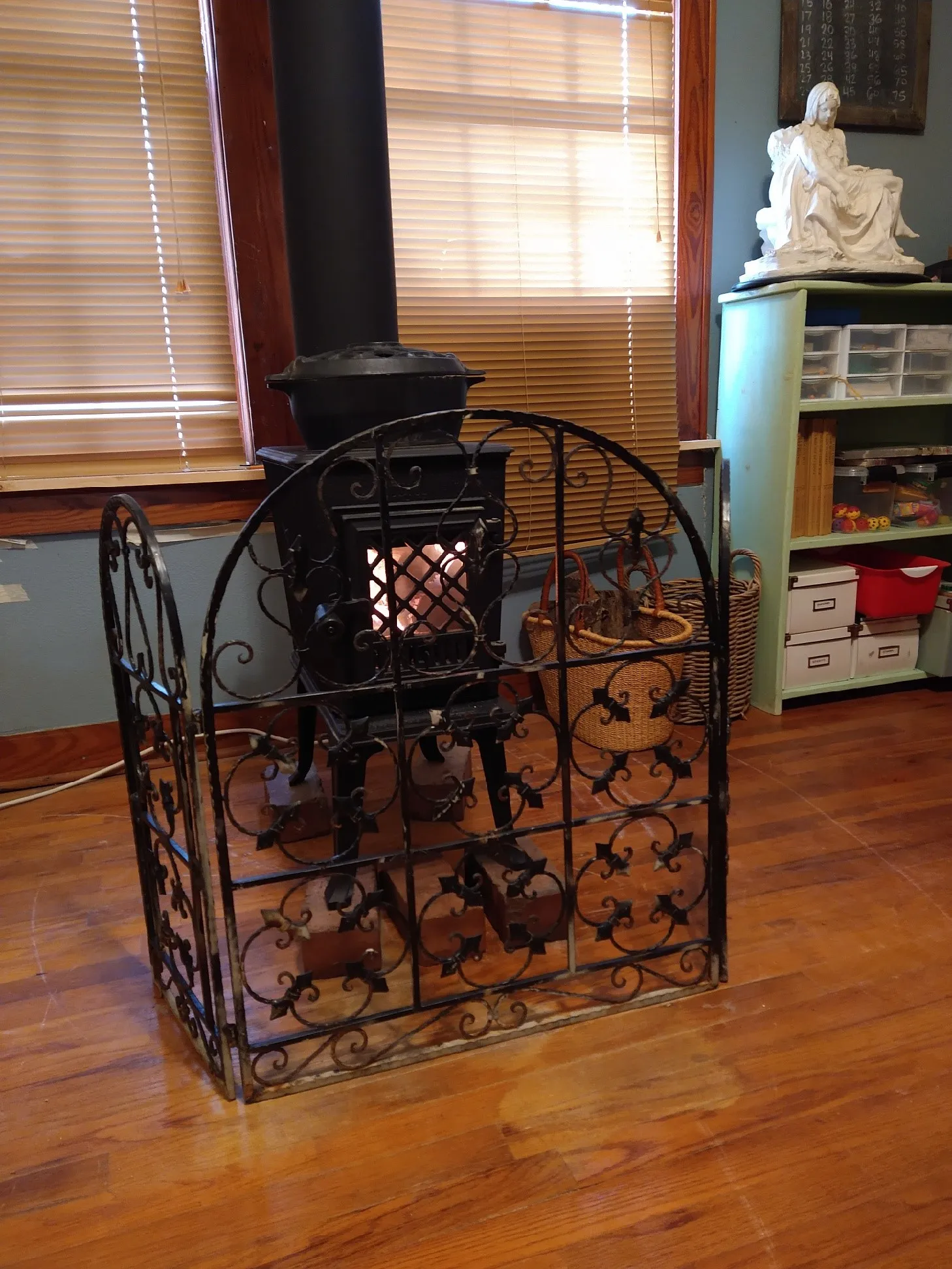 Freestanding vented cast iron wood burning cooktop stove located in the den/study. Room has built-in bookshelves.