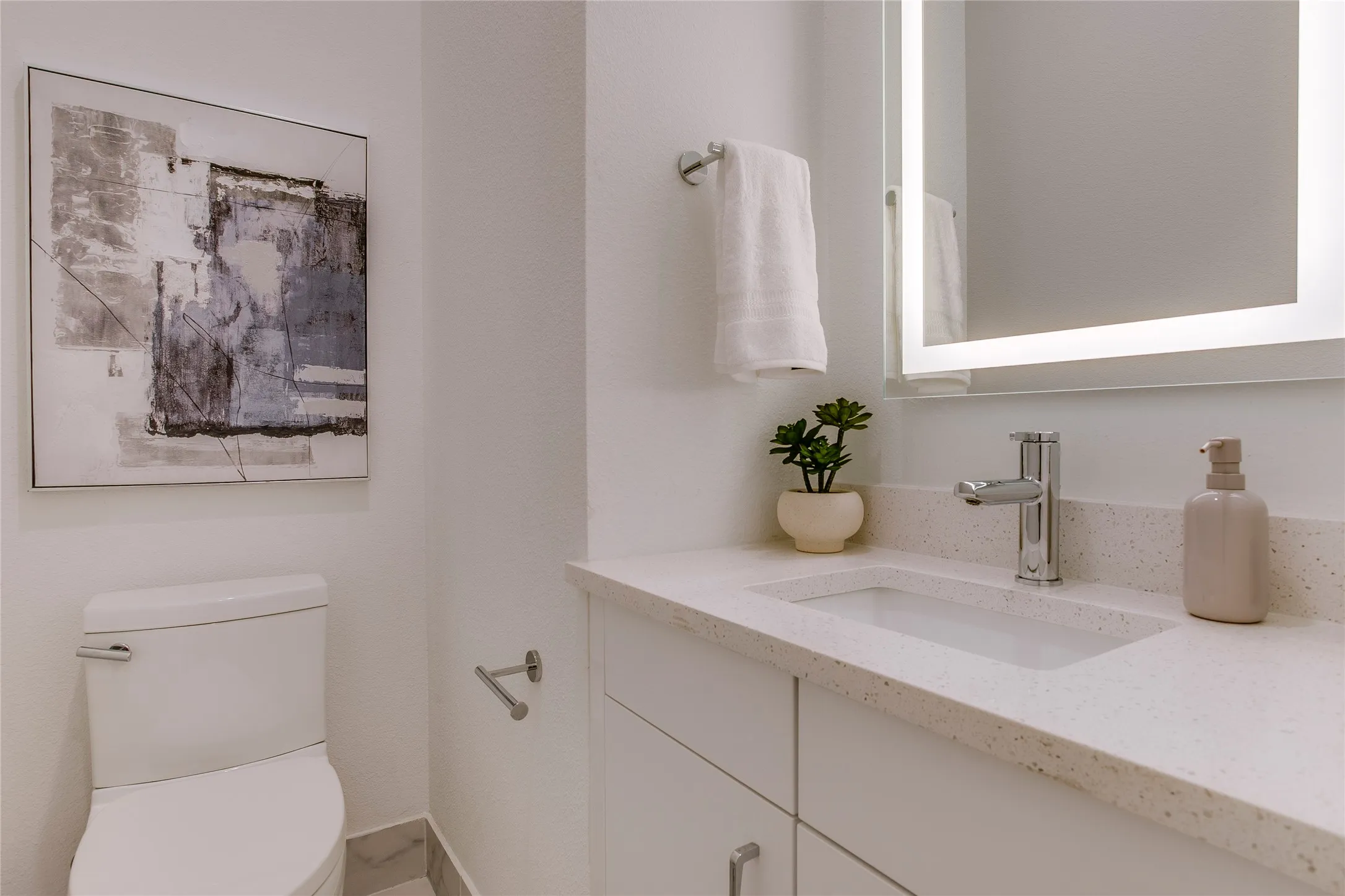 1/2 bath on kitchen level. Home is a rare 3.5 bath townhome.