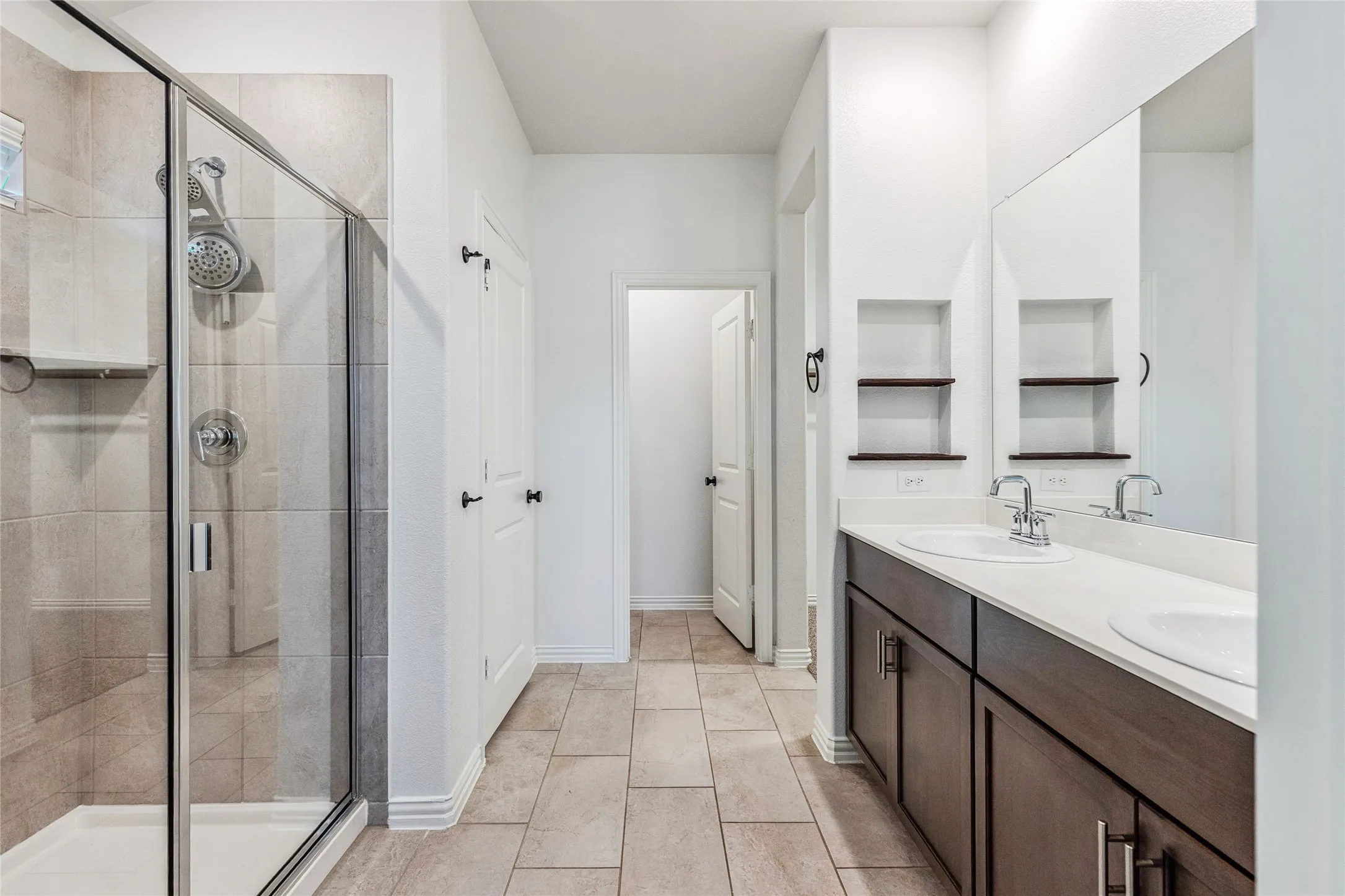 Dual vanity with undermount sinks and chrome fixtures