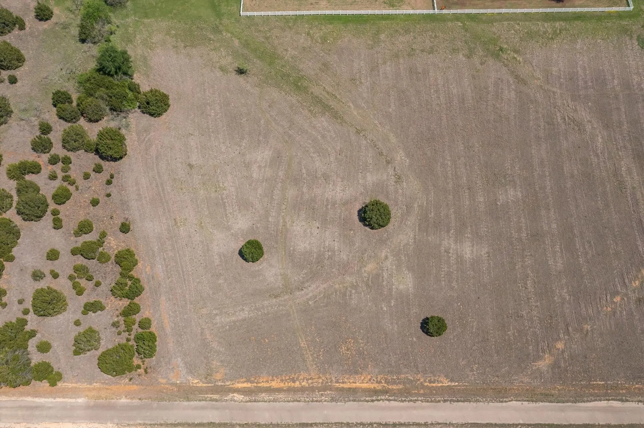 Expansive parcel featuring a combination of cleared land and natural shrubbery