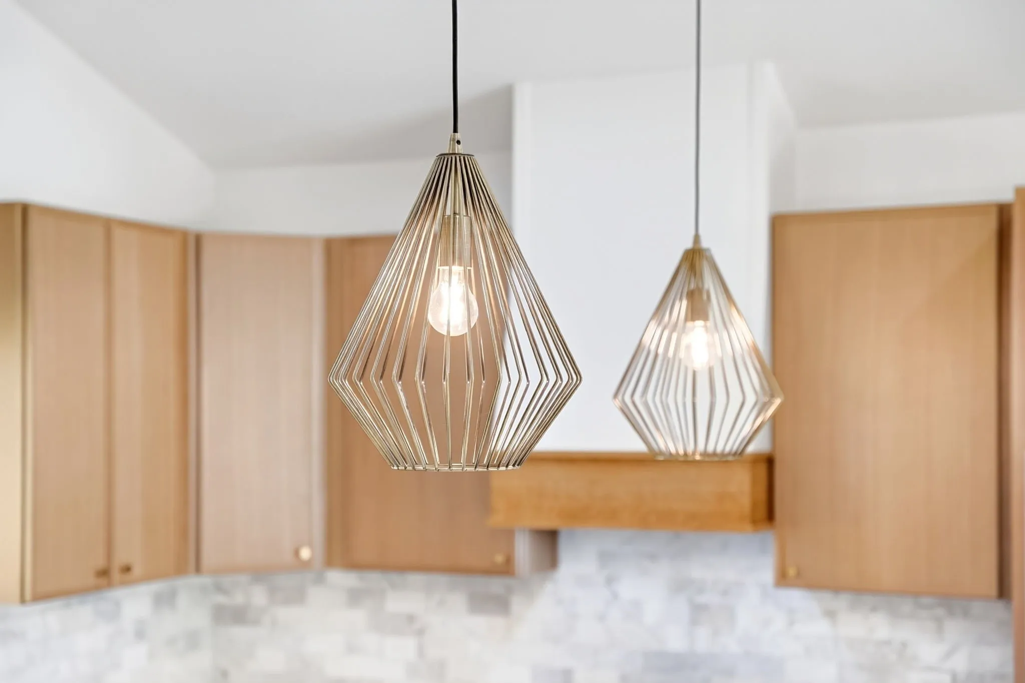 Two geometric pendant lights illuminate the space