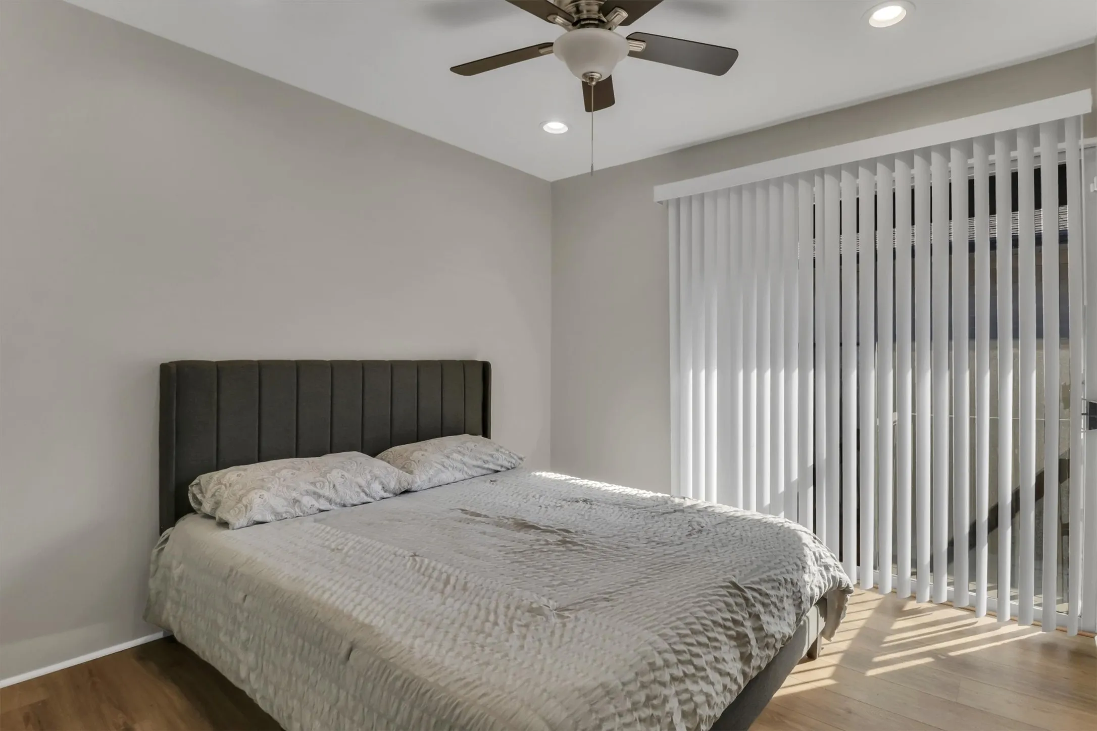 Bedroom featuring wood-finish flooring, recessed lighting, and a ceiling fan