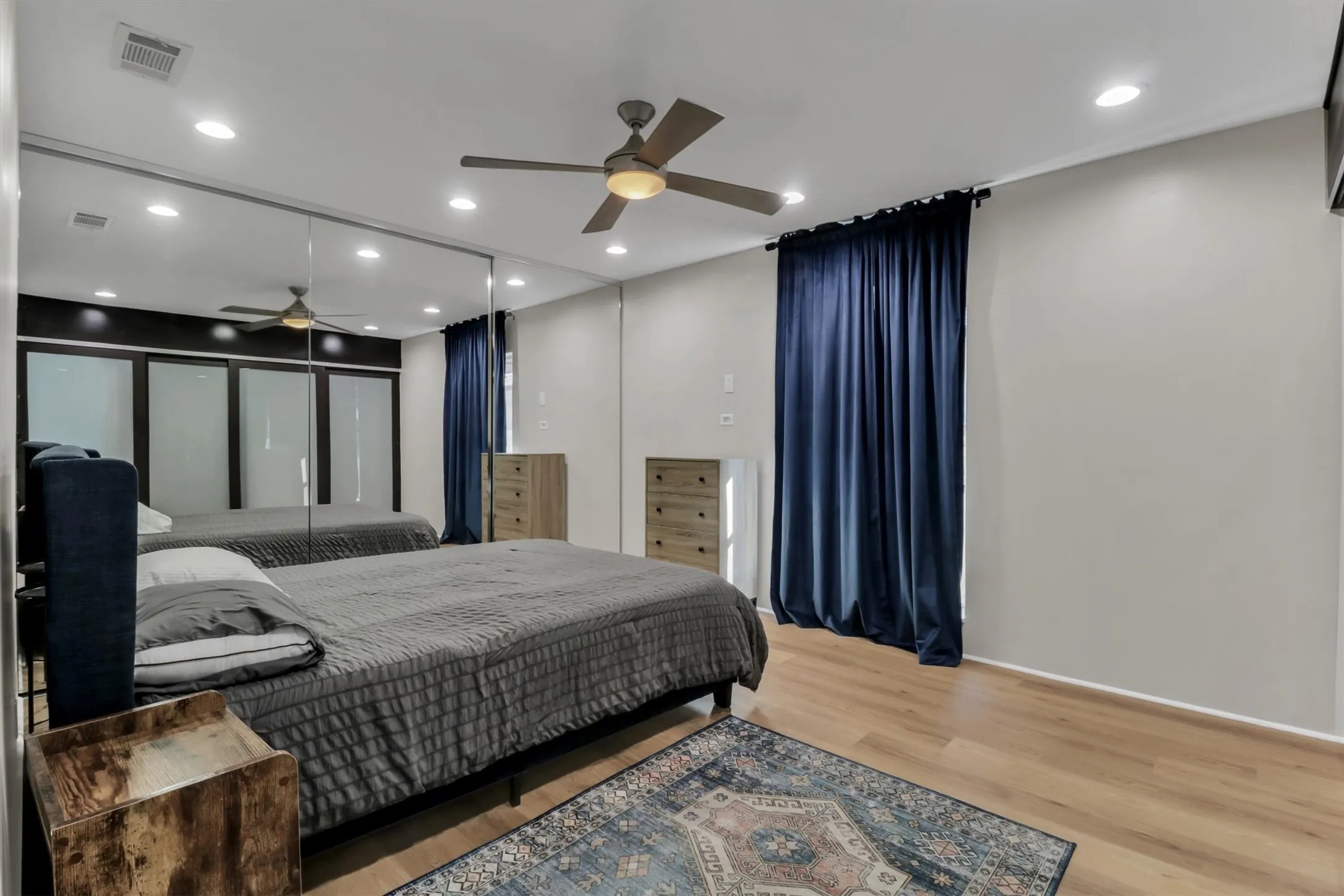Room featuring light wood-finish flooring, recessed lighting, and a ceiling fan