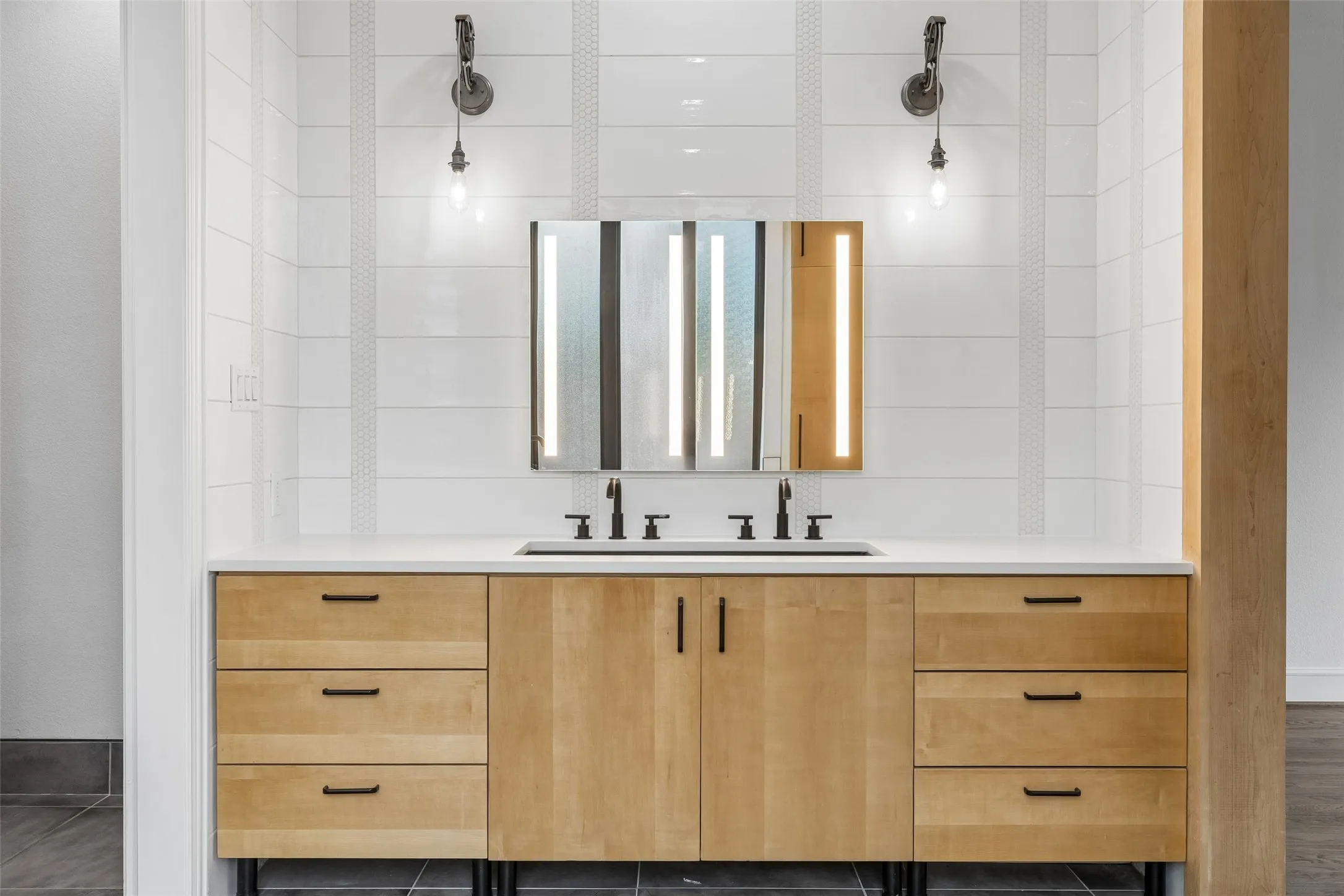 Reconfigured & renovated primary ensuite bathroom & walk in closet with custom organization.