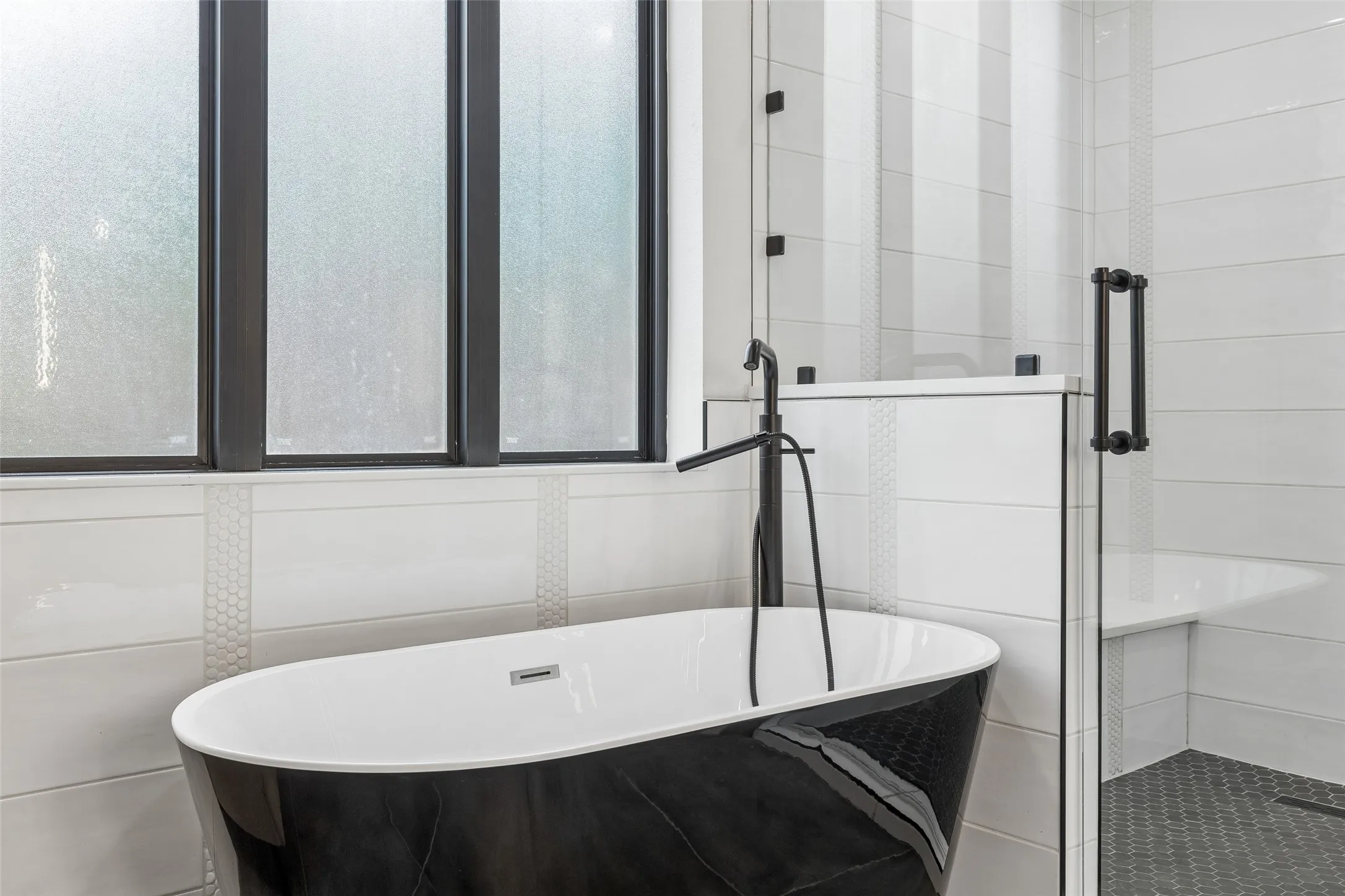 Reconfigured & renovated primary ensuite bathroom & walk in closet with custom organization.