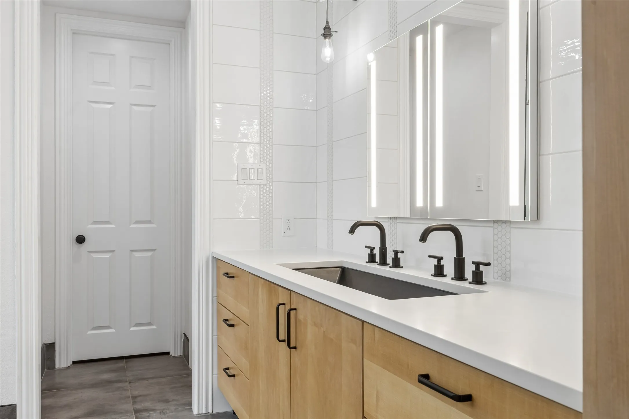 Reconfigured & renovated primary ensuite bathroom & walk in closet with custom organization.