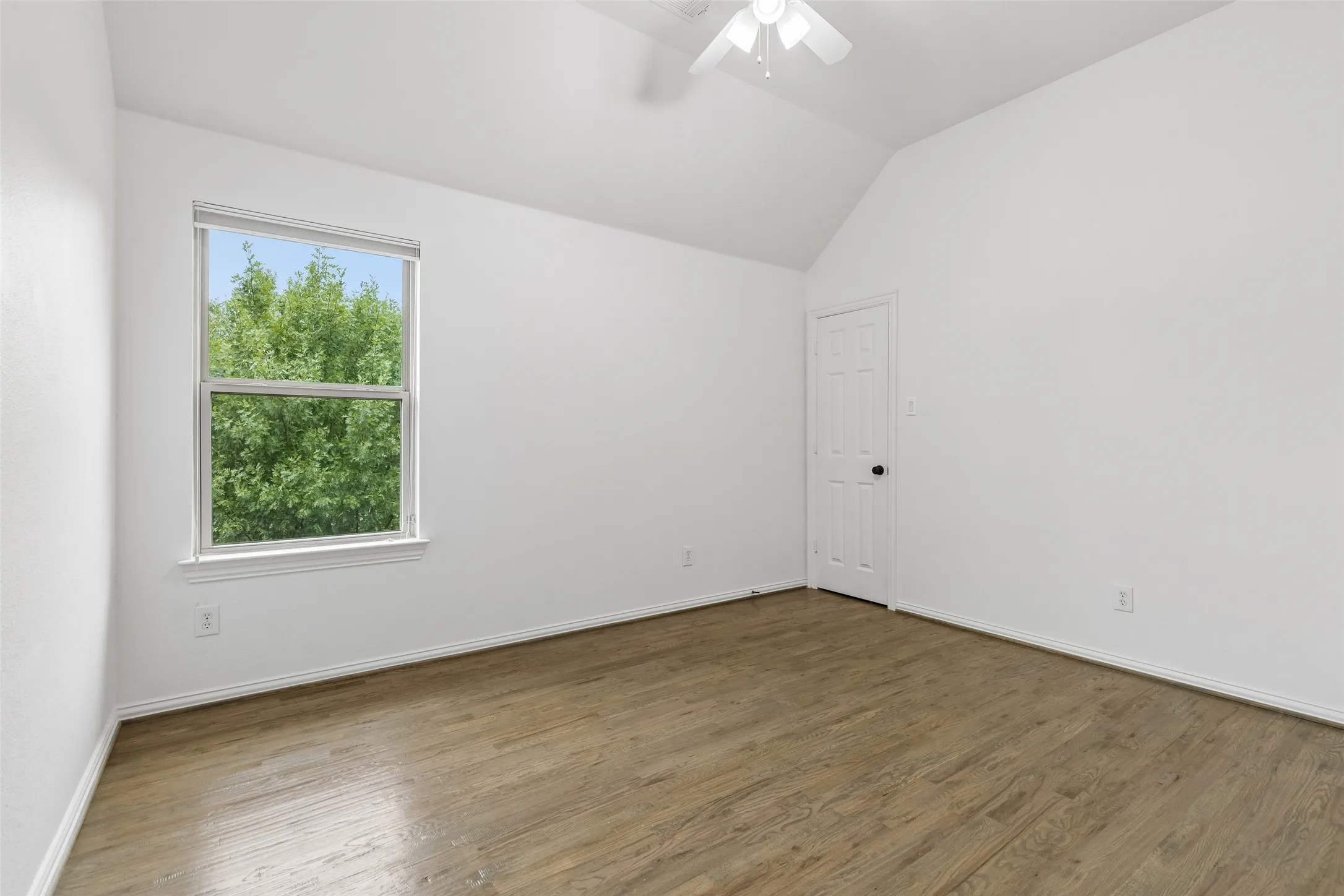 2nd level guest bathroom with refinished hardwood floors and walk in closet.