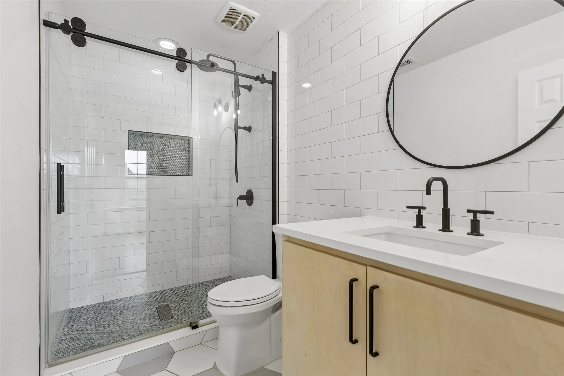 2nd level guest renovated en suite bathroom with walk in shower.