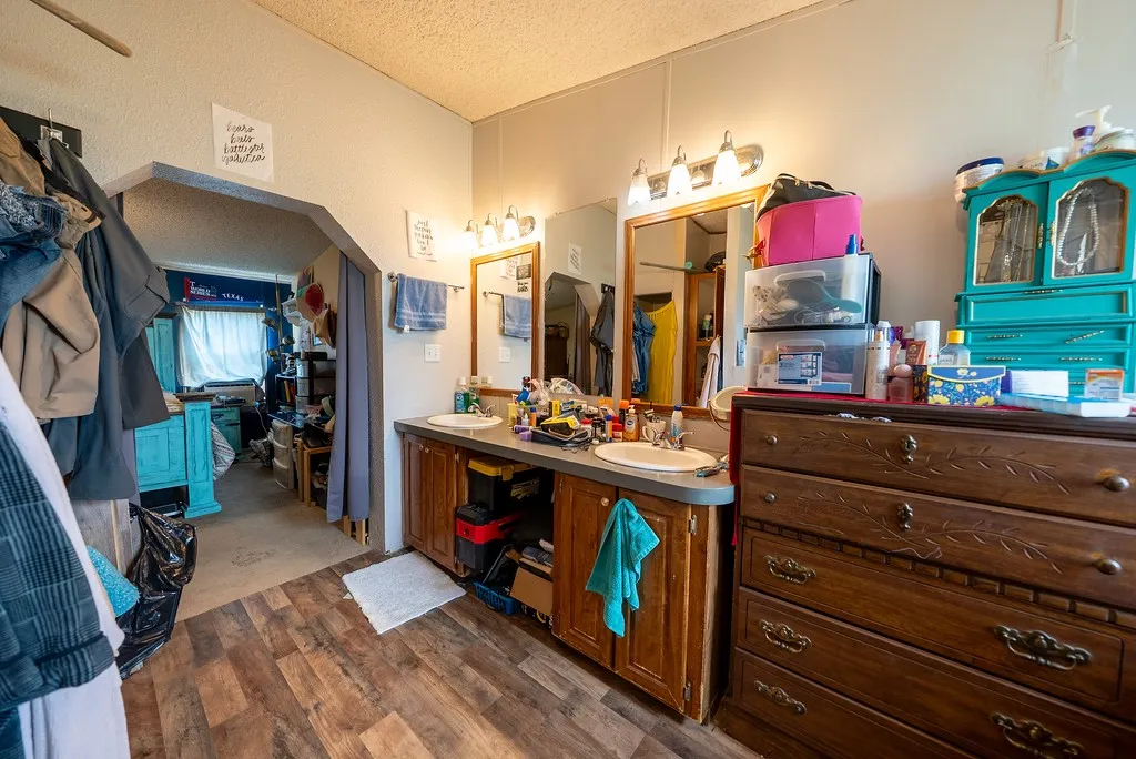 Double vanity with undermount sinks and wood-finish cabinetry