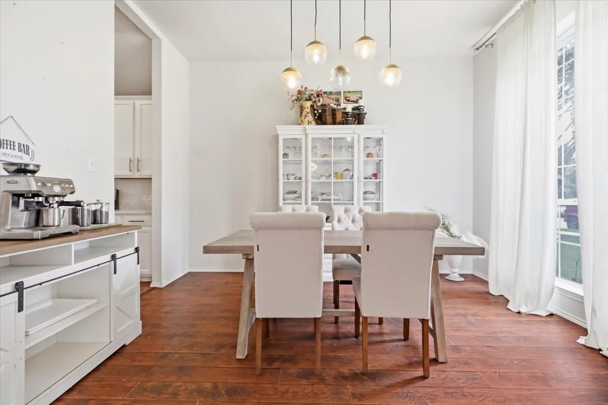 Dining area with wood-finish flooring