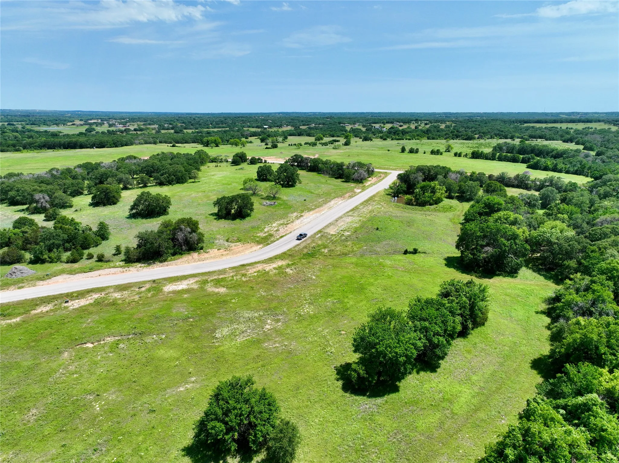 Birds eye view of property featuring a rural view